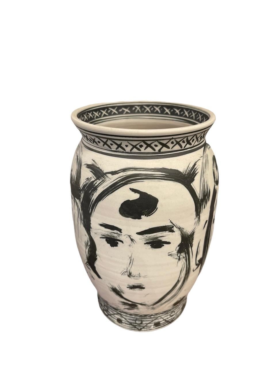 Four Faces (1993) - Porcelain and terra sigillata vase, signed, titled and dated on bottom, by artist Edward Eberle, (American/Western PA, born 1944). 
 