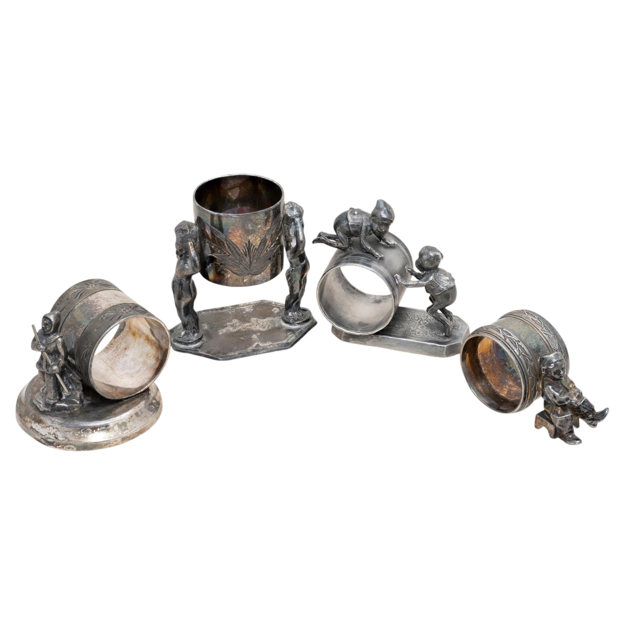 Four Figural Victorian Silverplate Napkin Rings