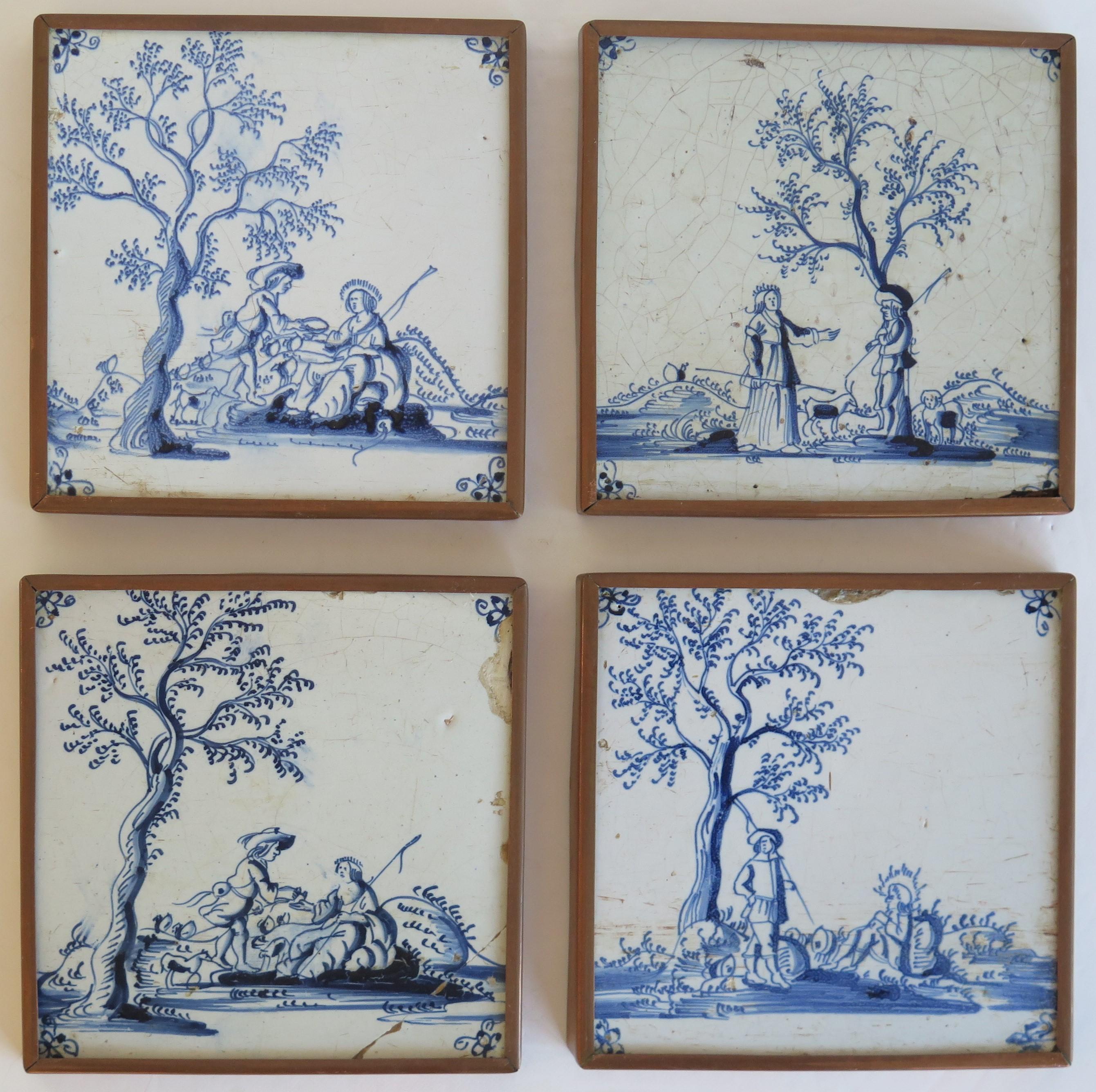 These are Four fine Delft ceramic wall tiles all with a blue and white hand painted similar pattern, made in the Netherlands during the late 17th / early 18th Century, circa 1700 and mounted in custom made copper frames all ready for