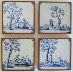 FOUR fine early Delft Blue and White Wall Tiles in Copper frames, Ca 1700
