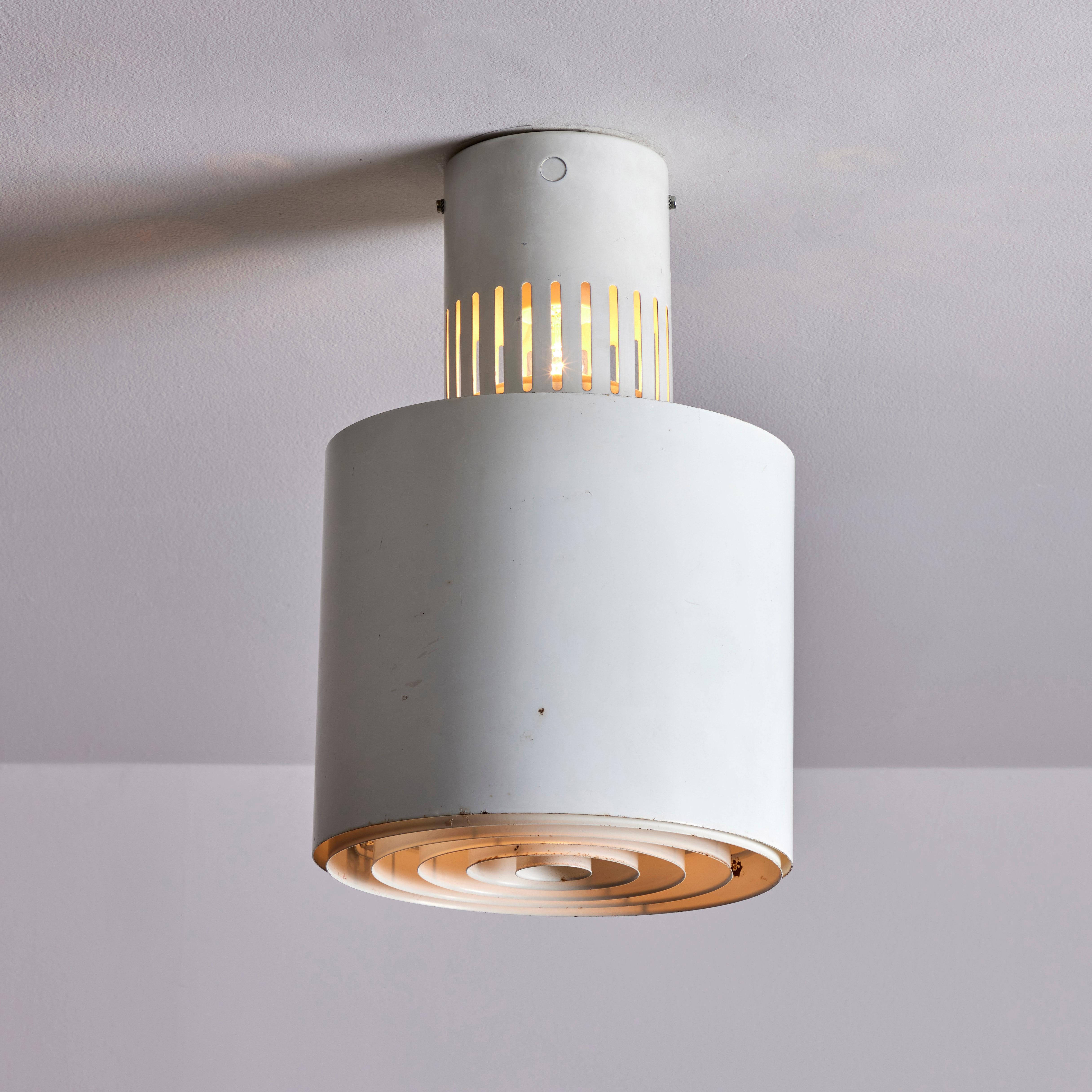 Flush mount ceiling lights by Lisa Johansson-Pape. Designed and manufactured in Finland for the National Library. Painted metal. Rewired for U.S. standards. We recommend one E27 60W maximum bulb per fixture. Bulbs are not included. Priced and sold