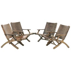 Four Folding Leather Armchairs