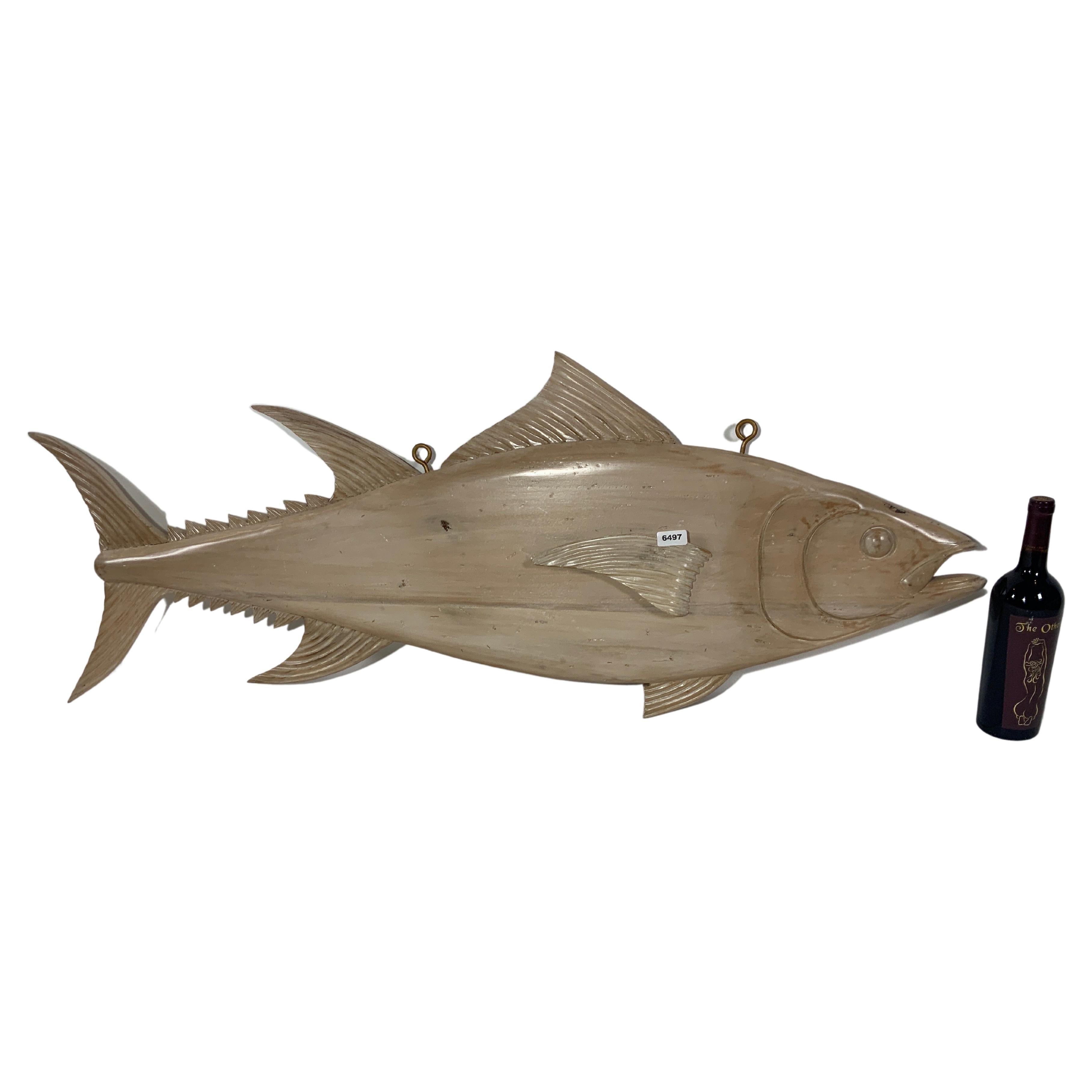 Four foot carved Atlantic bluefin tuna with a light bleached finish, details include fins, gills, eyes, snout, etc. Fitted with iron hanging hooks. This piece is reminiscent of the trade signs that fishmongers would hang above their stalls on the