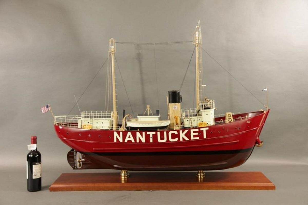 Four foot model of the Lightship Nantucket. What a great model, with perfectly scaled hardwood hull mounted to a mahogany baseboard with heavy milled brass pedestals. Many of the fittings as well as the masts are milled. 

Overall dimensions: 51