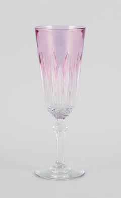 Four French champagne flutes in crystal glass. Classic design in purple glass.