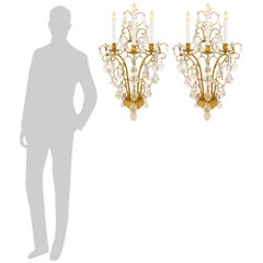 Four French Gilt Metal and Rock Crystal sconces, attributed to Maison Bagues