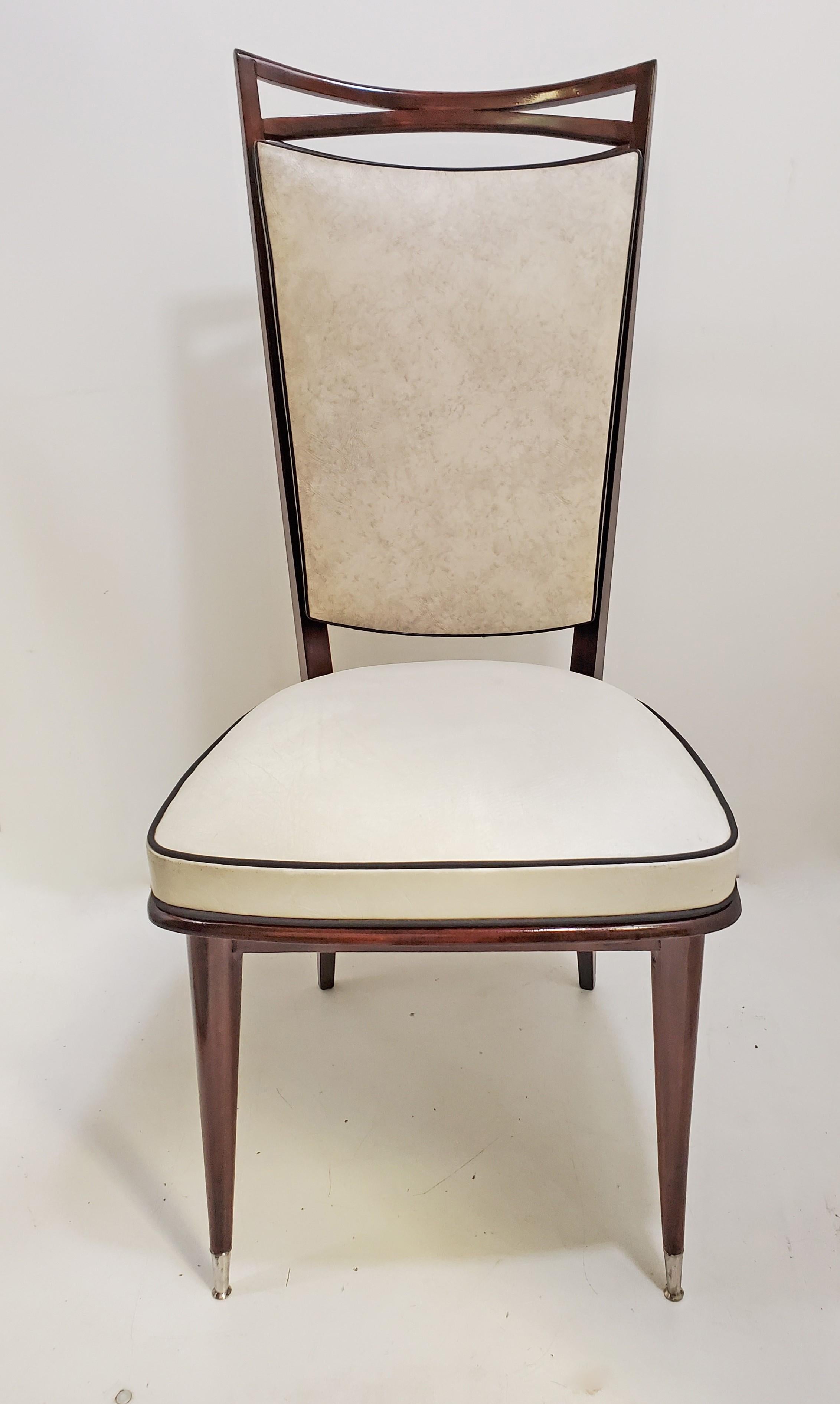 Set of four original French Modernist dining or side chairs featuring an open airy 