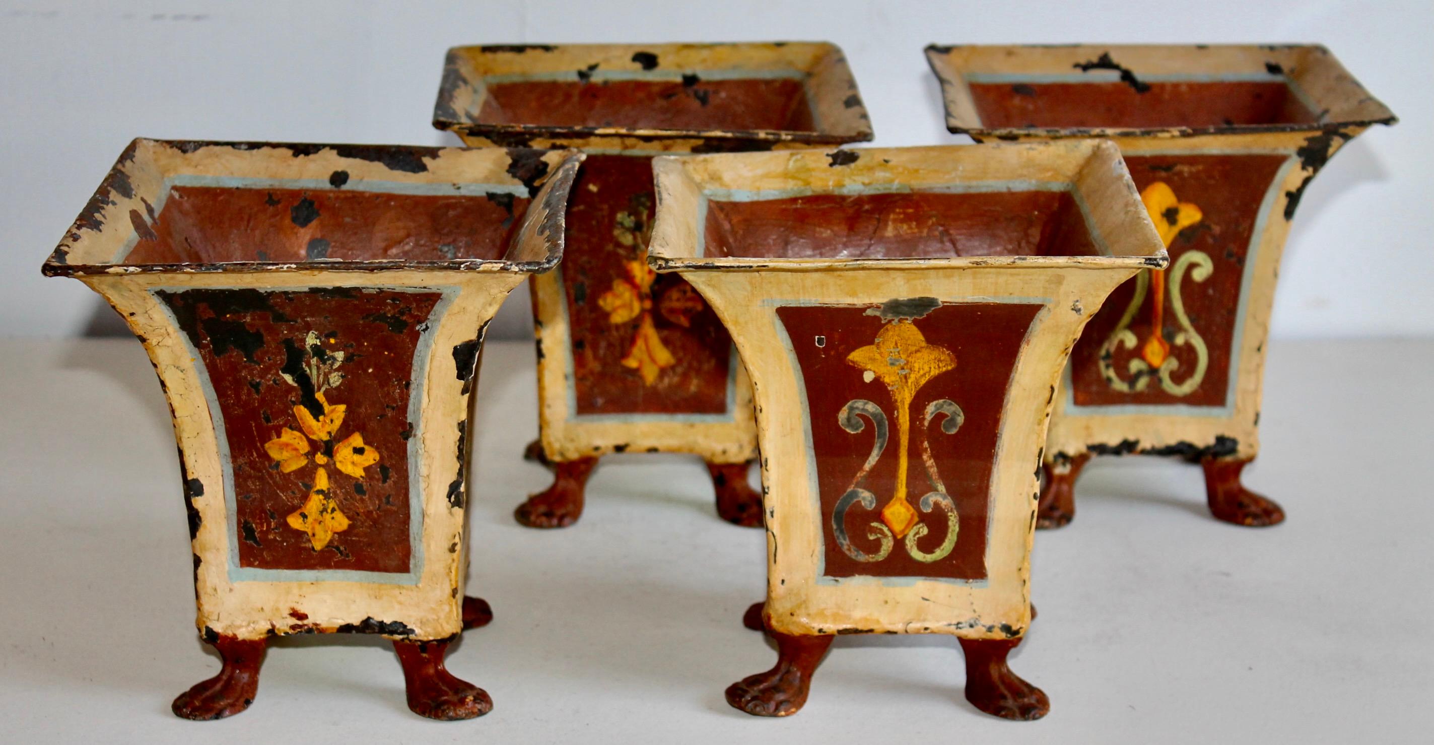 Four hand Painted and footed 19c. Tole Planters.  Retaining two Michael Walter Lexington Gardens NYC labels