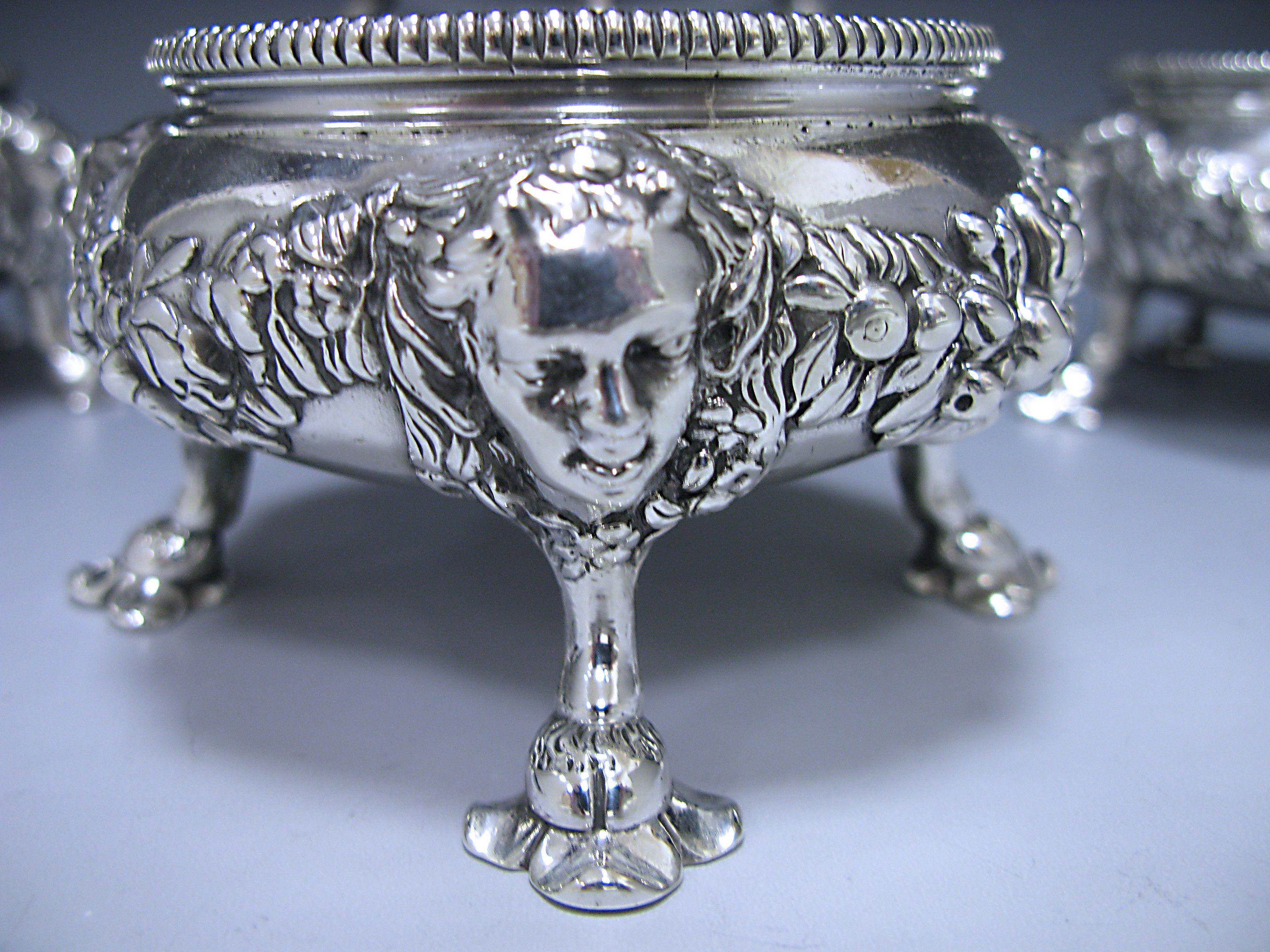 Four magnificent George II antique silver salts, one pair 1750 made by Peter Taylor of London and one pair 1769 by Parker & Wakelin of London. The firm of Parker and Wakelin was the foremost silversmith in London for much of the eighteenth century,