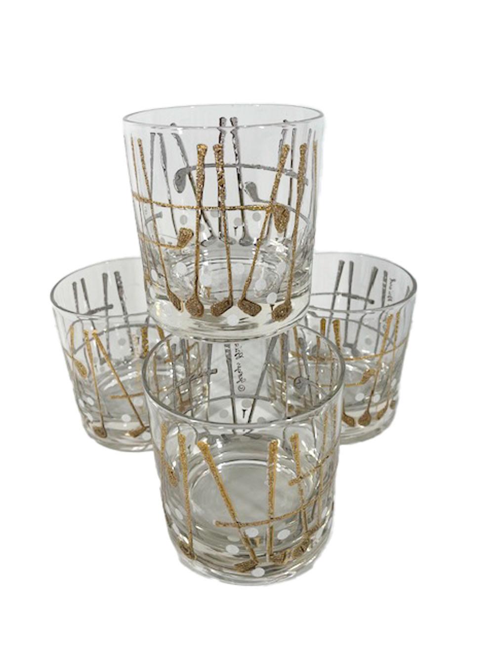 Four vintage Georges Briard golf theme glasses with raised white enamel clubs and balls, the clubs overlaid with 22 karat gold.