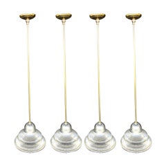 Four Glass and Brass Pendant Lights