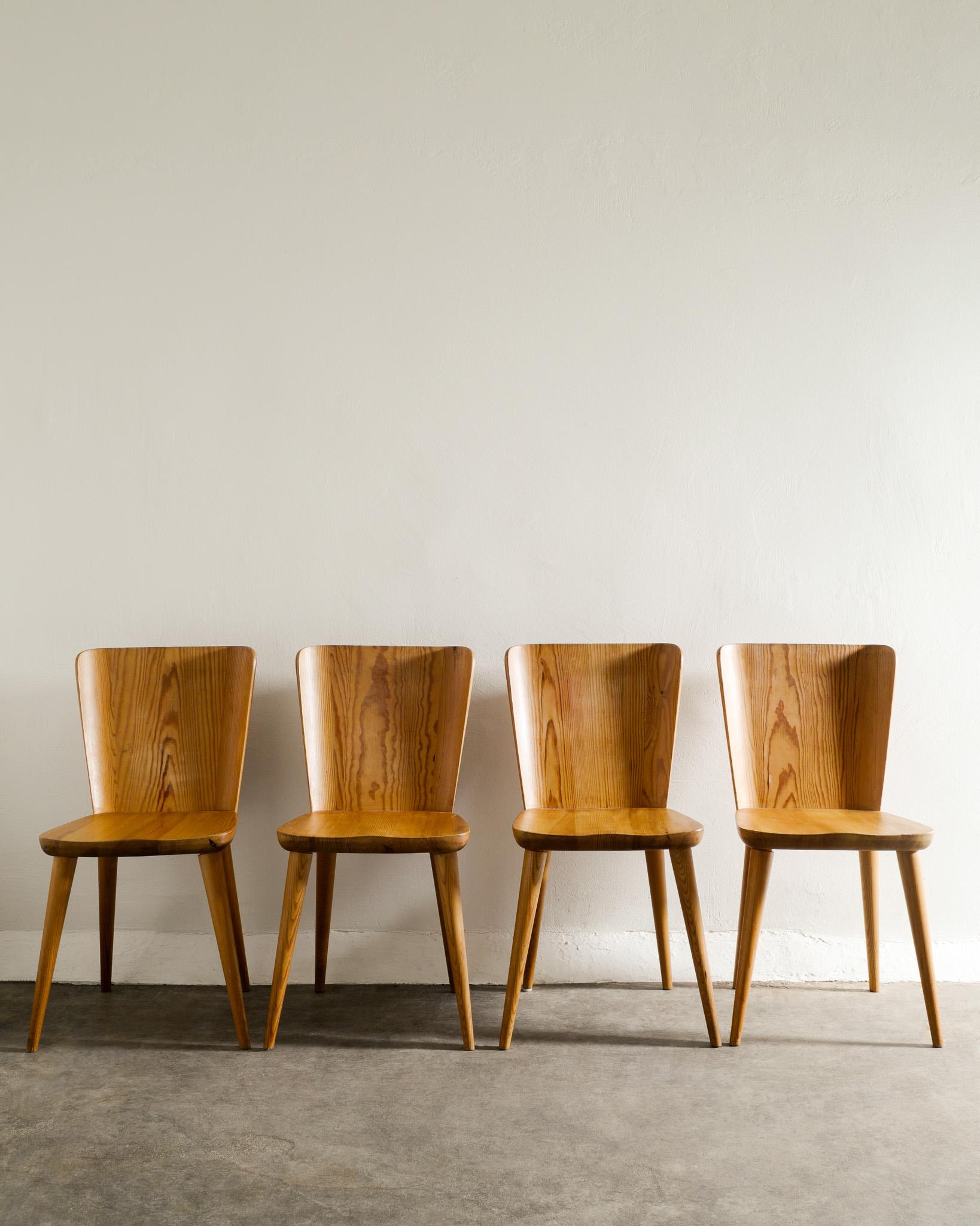 Rare set of four mid century dining chairs in pine by Göran Malmvall produced by Svensk Fur, 1940s. In good original and matching condition. 
All chairs are stable and have been gone through by our professional.

Dimensions: H: 80 cm / 31.5