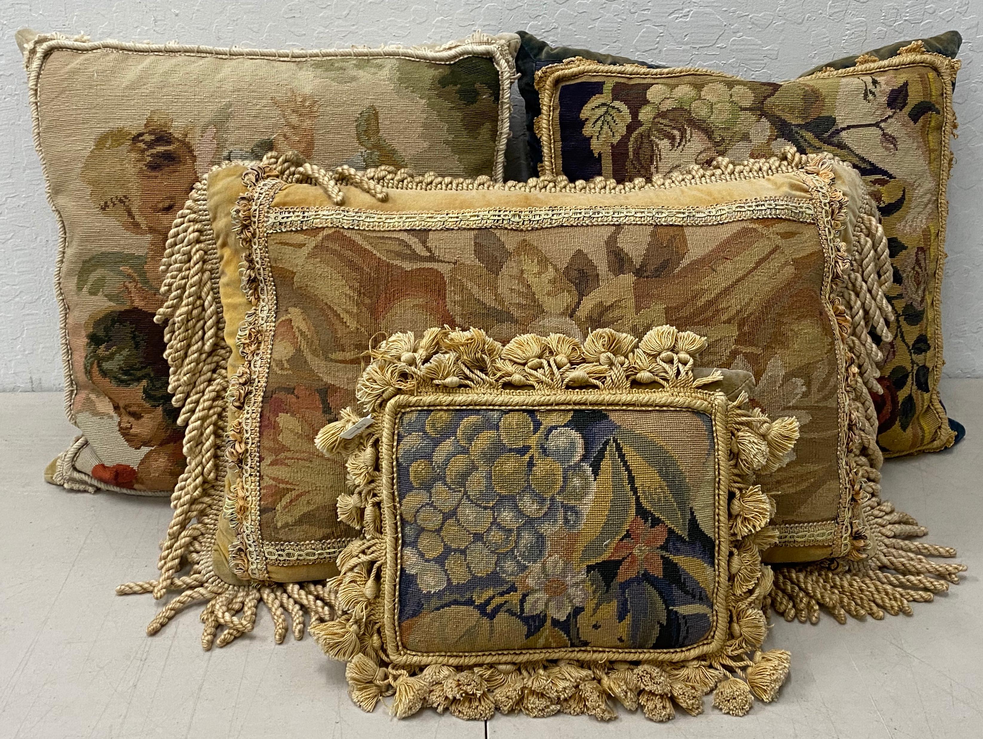 Four gorgeous petit point and needlepoint throw pillows with classical scenes, 20th century.

Absolutely beautiful collection of throw pillows, each a different size.

Each pillow depicts a scene of classical elegance; from a putti with fruit to