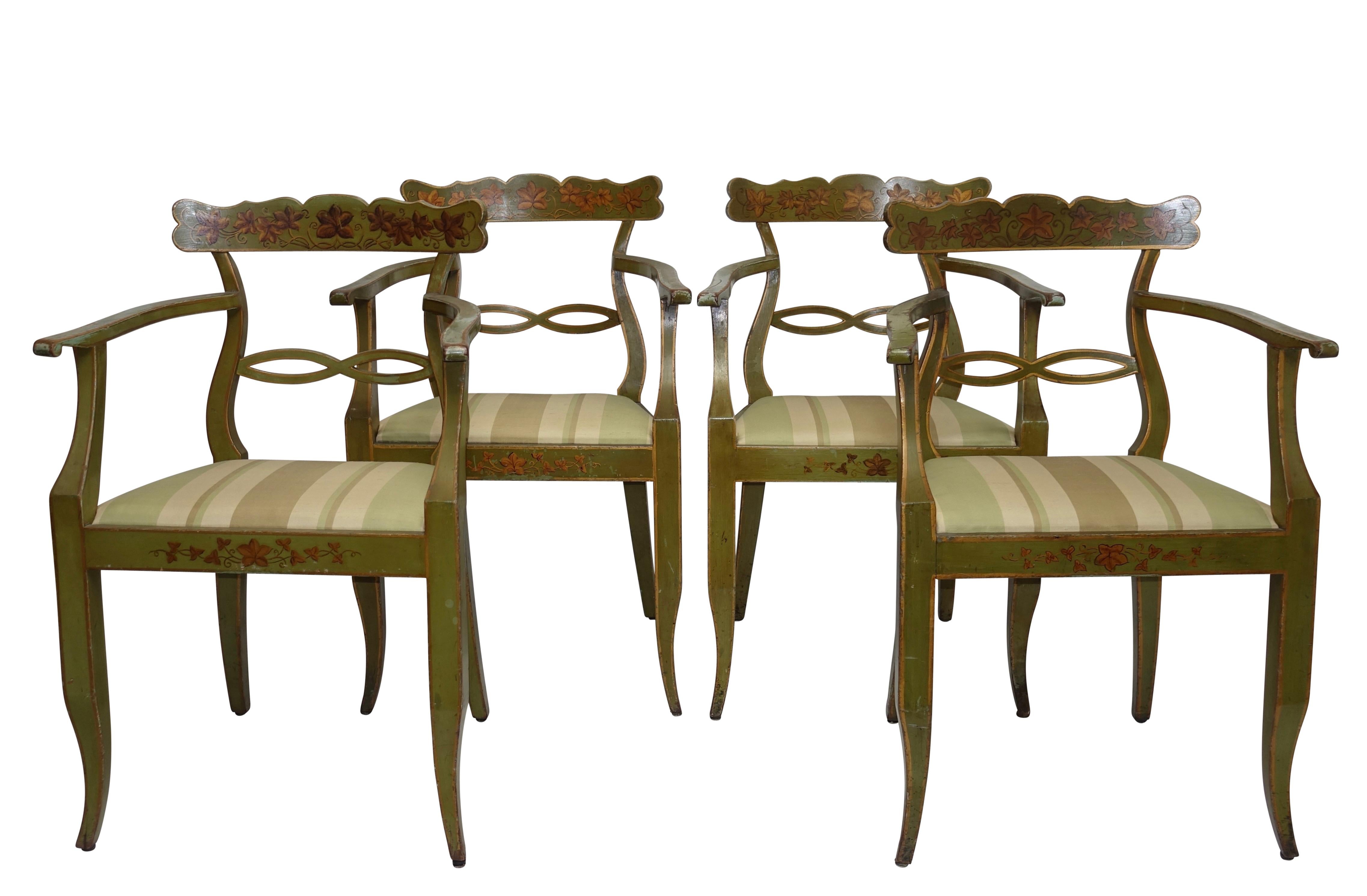 A set of four green painted armchairs with gilt accenting and vining ivy across the back rail and the front apron. Recently upholstered with green silk stripe fabric on the drop in seats. Northern European, 19th century.
Appropriate and expected