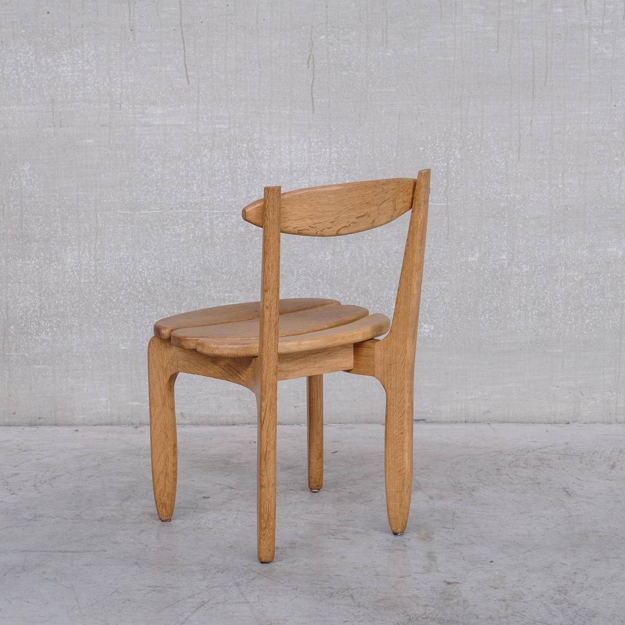 A scarce set of solid oak dining chairs by Guillerme et Chambron. 

The rare and much sought after 'Thierry' model. 

France, c1960s. 

Stamped underneath. 

We have a set of six available in a separate listing at the time this was posted. So a set