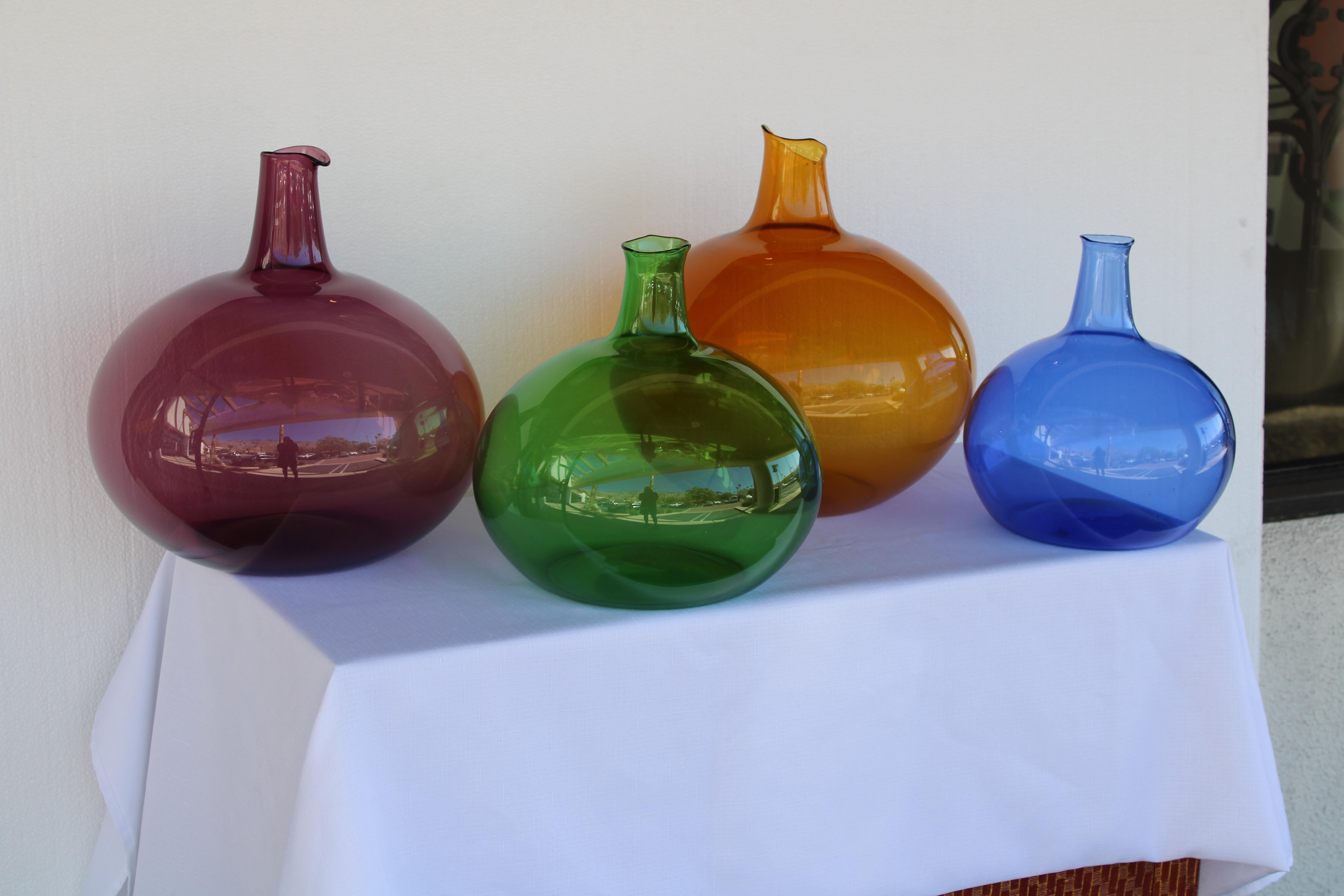 Four hand blown glass vessels by the Zeller Glass Company, Morgantown, West Virginia.  The caramel vessel measures 15