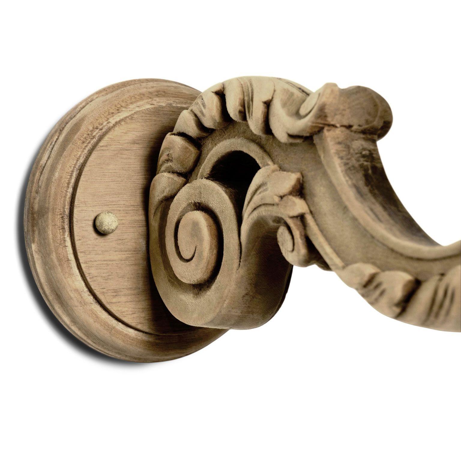 Four hand-carved bleached walnut single-arm sconces circa 1930-1954, France. Newly-wired for use within the USA. Each sconce accommodates a candelabra-size bulb. Sold as a set of four priced $5,600.