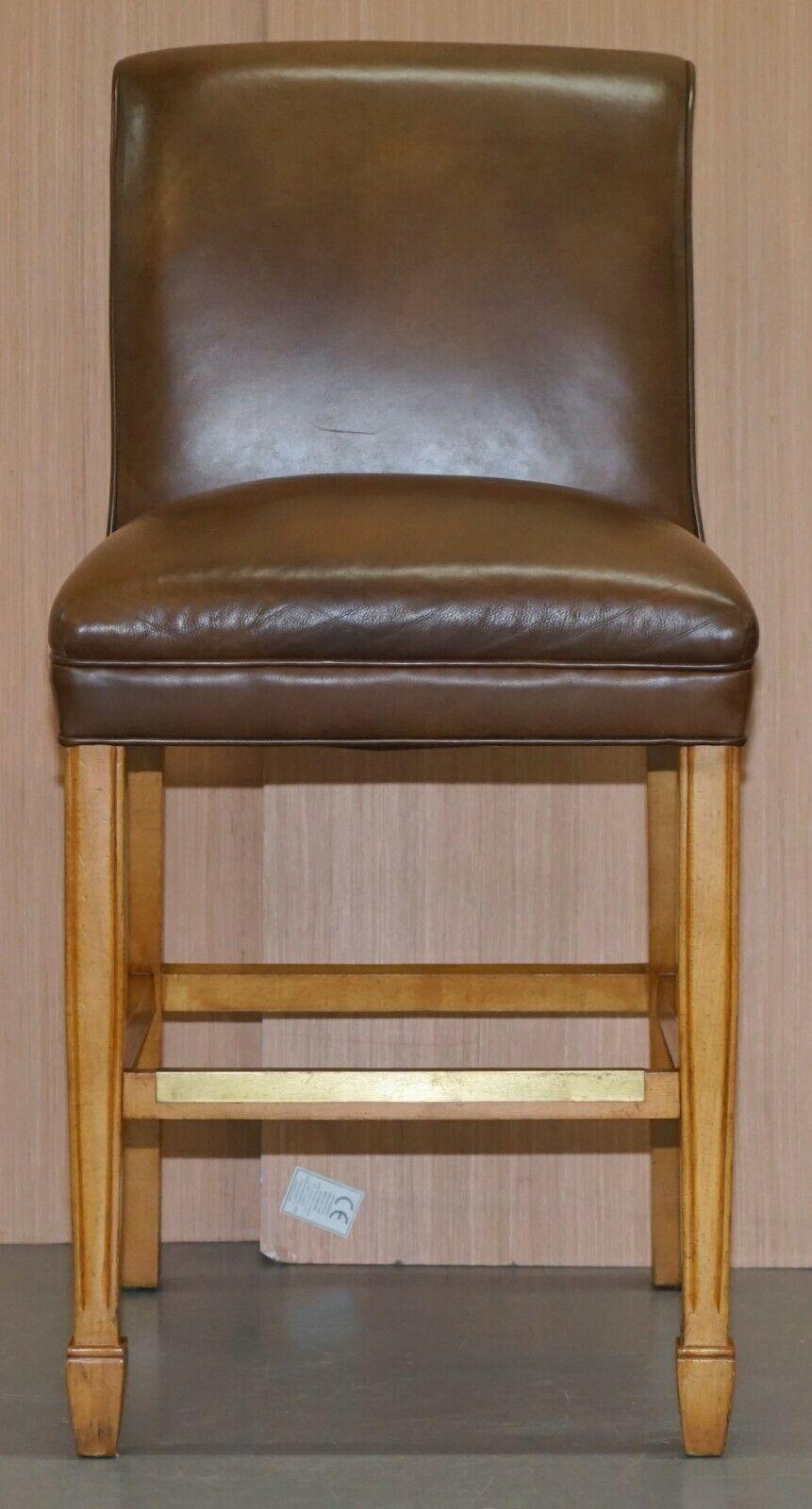 We are delighted to offer for sale this set of 4 hand dyed brown leather high light mahogany bar stools by Hancock & Moore

They are absolutely sublime quality, the line of the timber when looking from the back is amazing, they have metal footrest