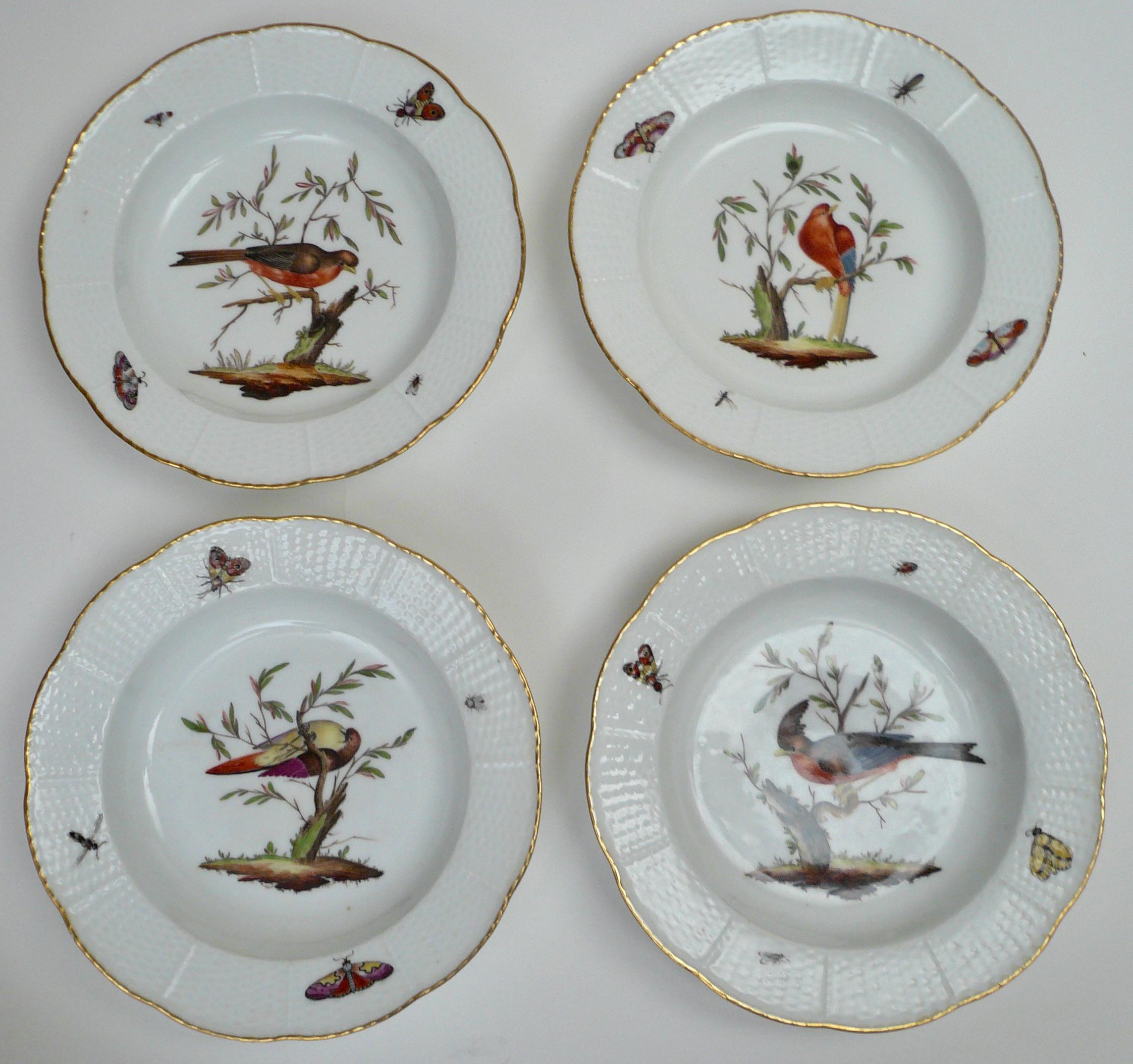These rare Amstel porcelain hand painted soup plates are beautifully decorated with various birds and insects. They feature basketweave borders, and gilt trim. Measures: 9.25
