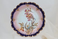 Four hand painted and gilded Limoges dessert plates