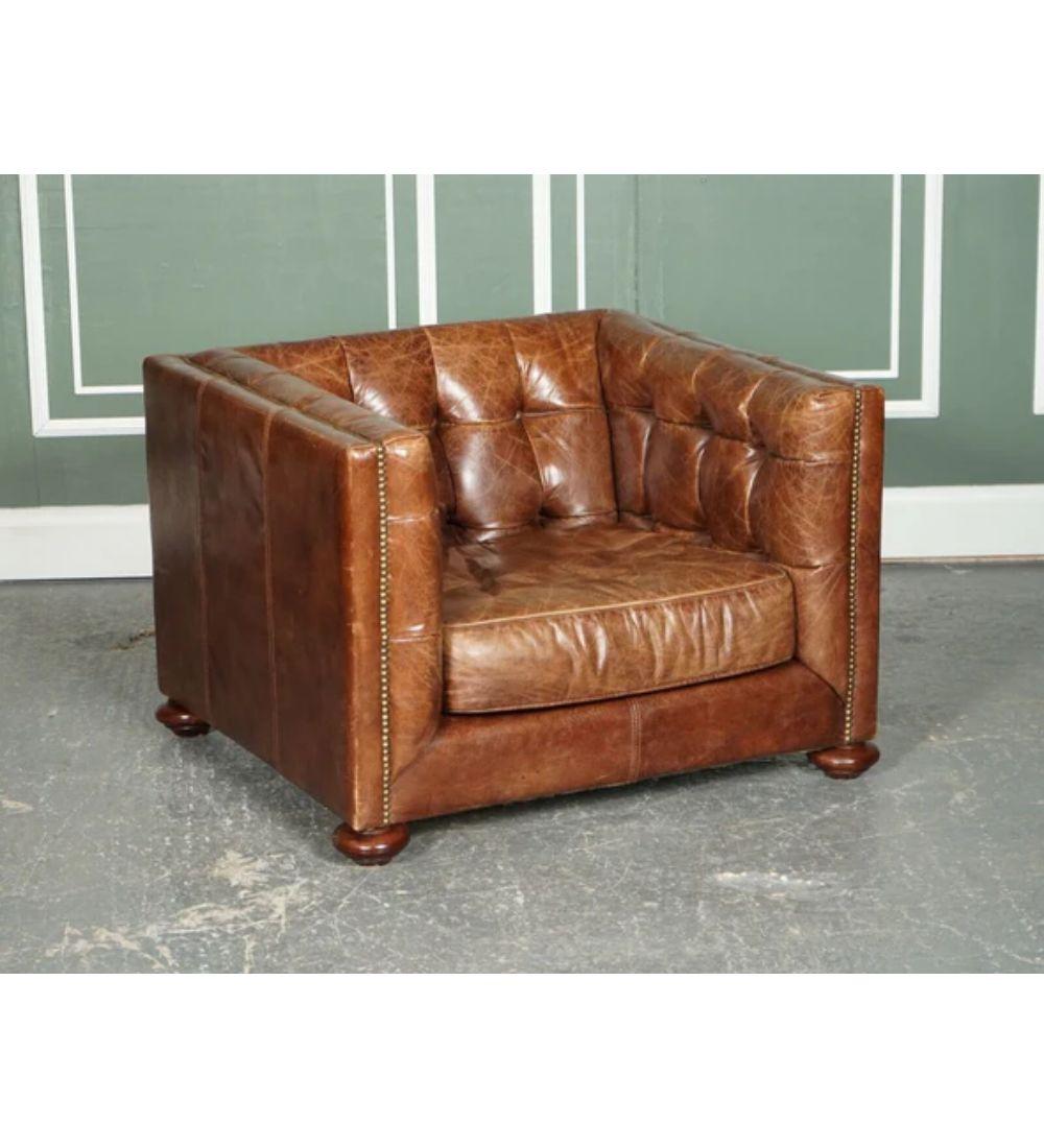 We are delighted to offer for this stunning four hands Abbott cigar brown leather gentleman club armchair.

Very good looking comfortable armchair. We have put a new hessian on the bottom and a new set legs. On the inside, it has chesterfield