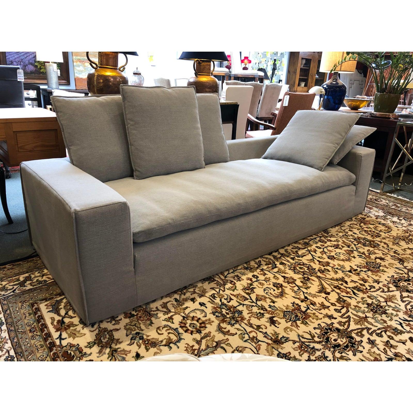 Design Plus Gallery presents a contemporary sofa by Four Hands. Contemporary in style with clean lines and neutral upholstery, the large seating has a low back which makes it perfect for use as a daybed or chaise as well as standard seating.