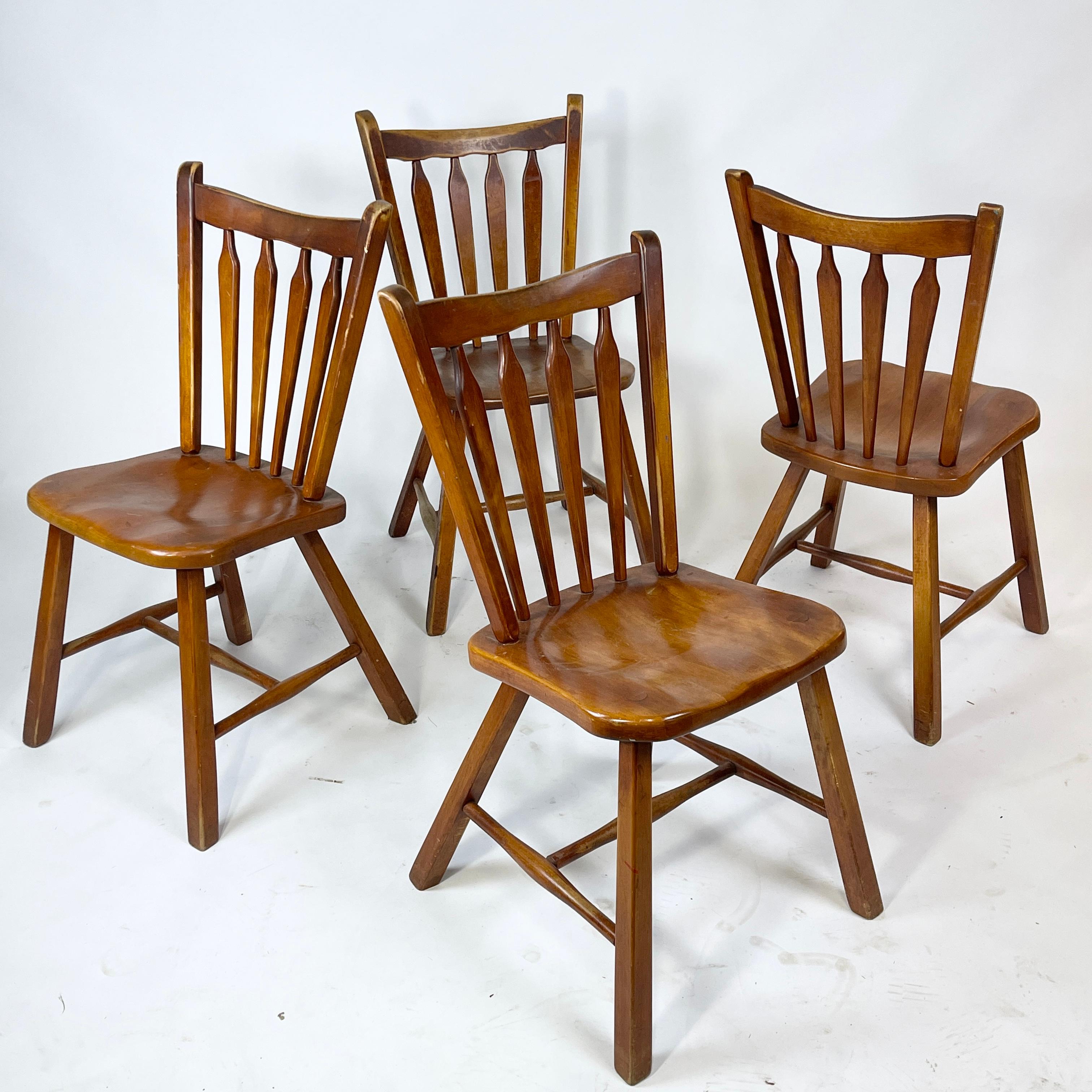Great piece of Americana with a modern twist. Stunning, sleek, yet sturdy. Perfect chairs for the country house. Set of four chairs with lovely patina. Chair seats are shown. One more worn than the rest however all are very solid and nicely