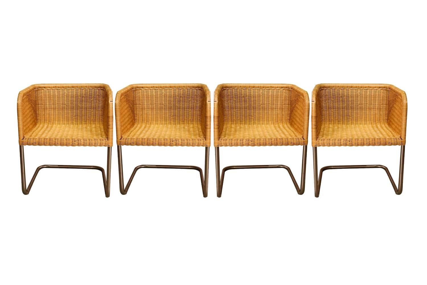 An amazing set of 4 vintage model D43 wicker and chrome cantilever chairs designed by Preban Fabricius & Jorgen Kastholm for Harvey Probber in Denmark. A rare set of Probber chairs featuring cube shaped frames with a woven wicker seat, back and