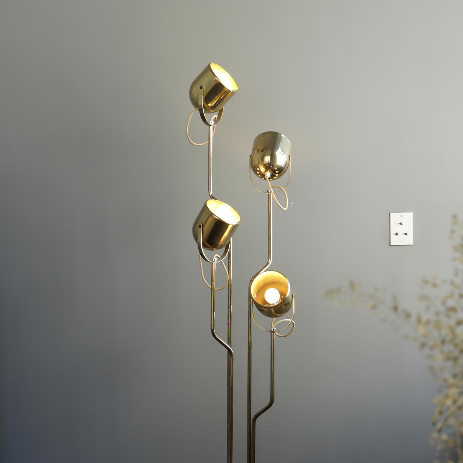 This golden brass floor lamp named 