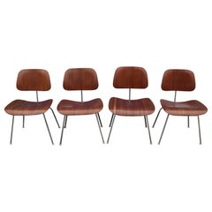 Four Herman Miller Eames Dining Chairs in Walnut