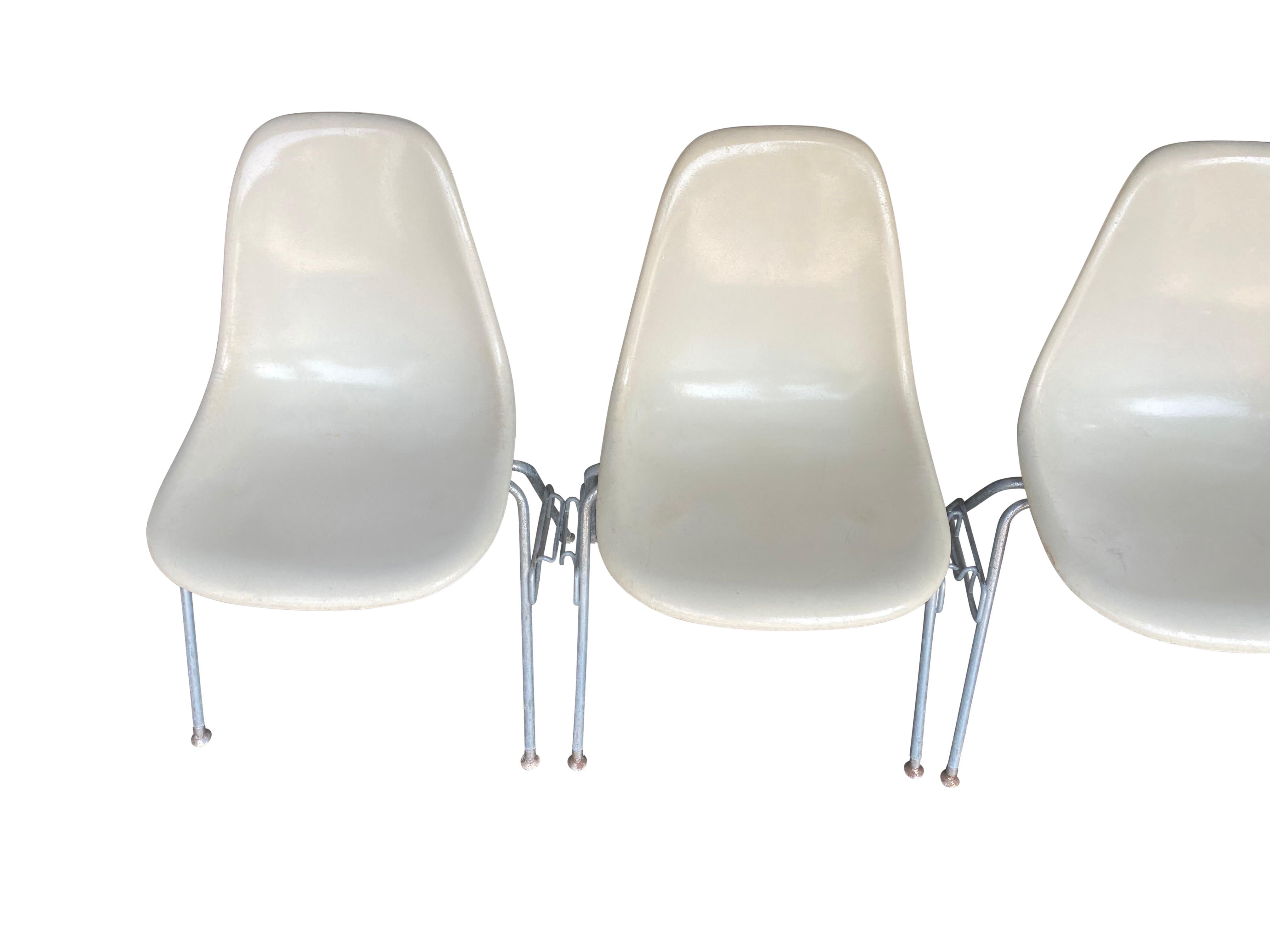 Mid-Century Modern Four Herman Miller Eames Fiberglass Stacking Dining Chairs For Sale