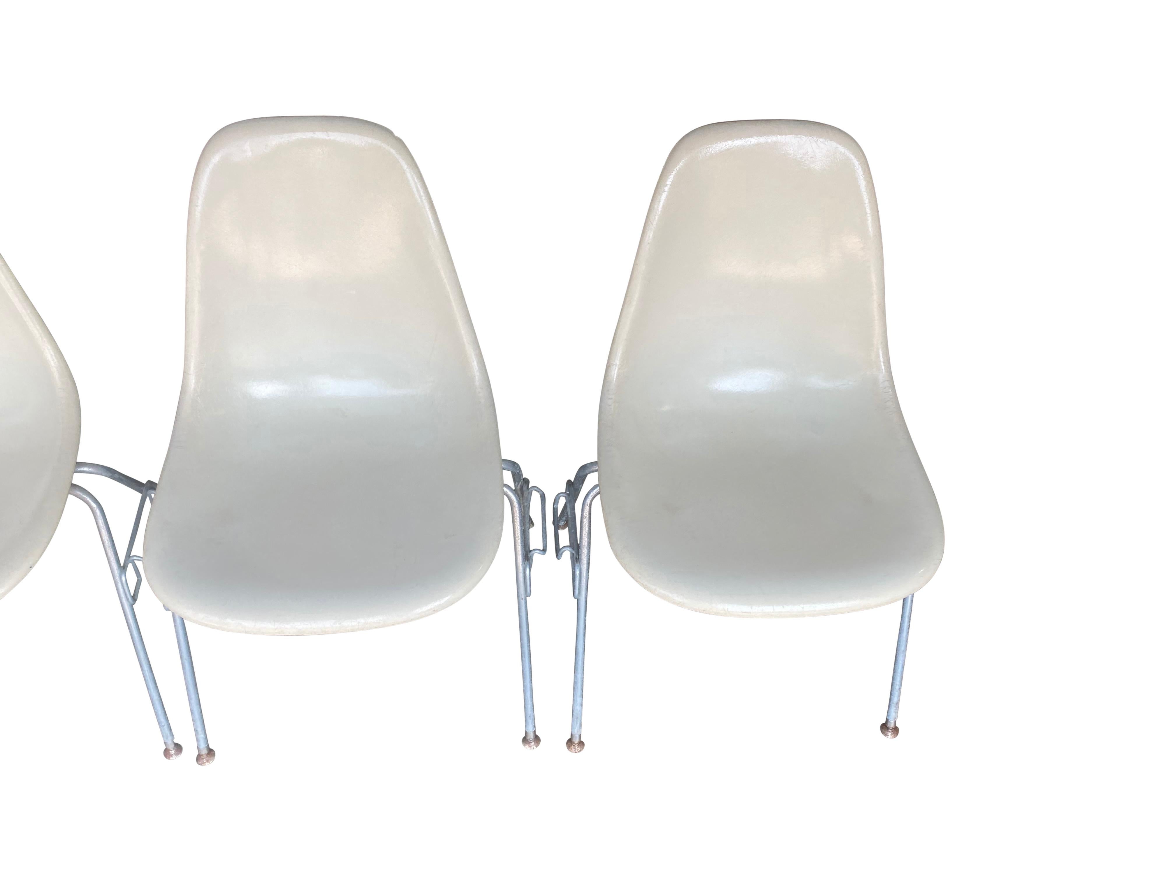 Four Herman Miller Eames Fiberglass Stacking Dining Chairs In Fair Condition For Sale In Brooklyn, NY
