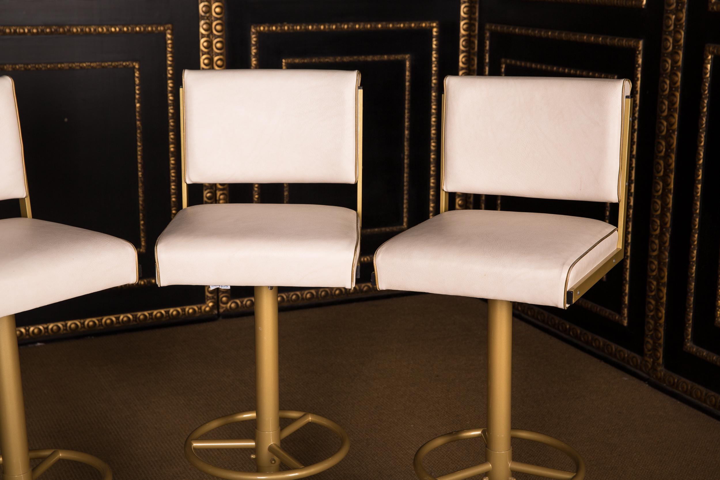 Modern Four High Quality Bar Stools Made of Metal in Golden Color