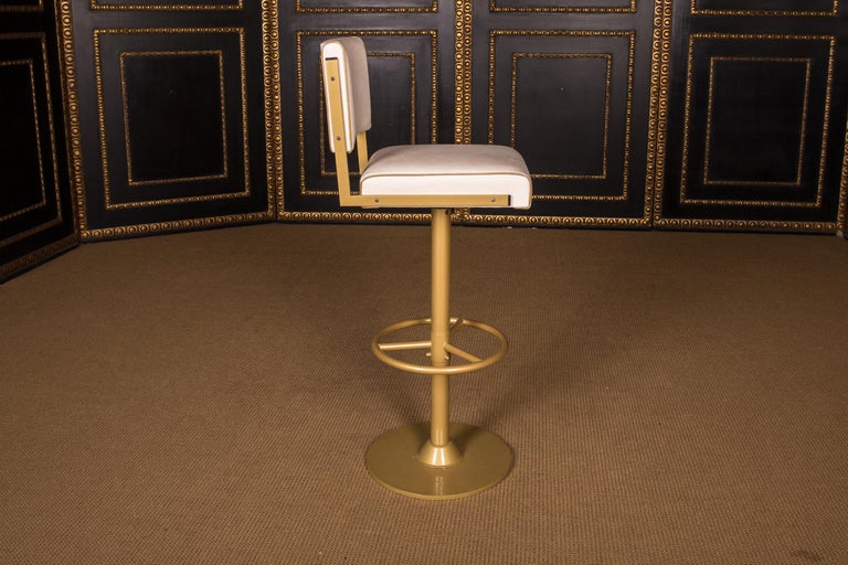 Four High Quality Bar Stools Made of Metal in Golden Color For Sale at