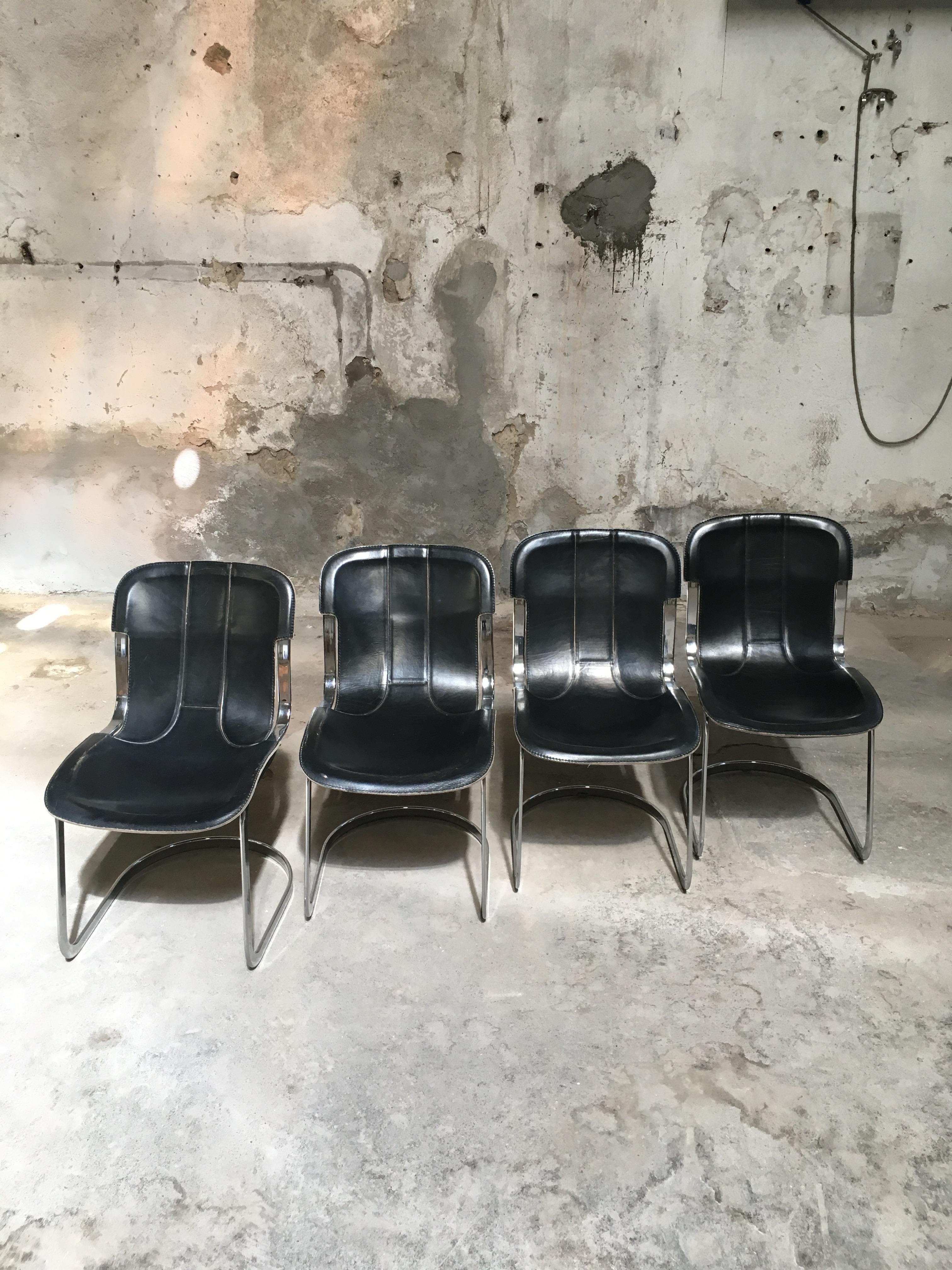 Mid-Century Modern Set of four Italian dining chairs in black leather and steel designed by Willy Rizzo for Cidue during the 1970s.