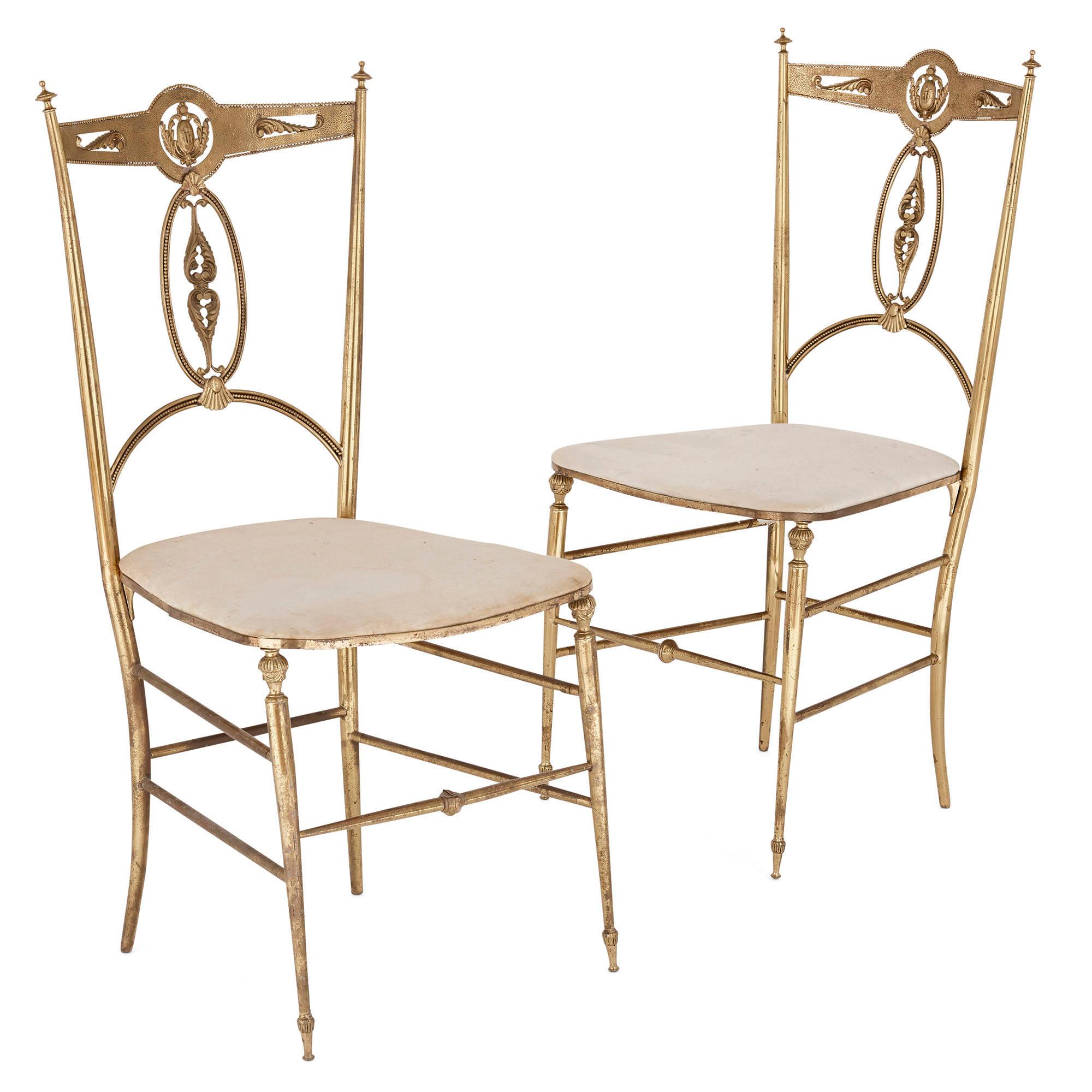 Four Italian 'Chiavari' brass and velvet chairs
Italian, early 20th century
Measures: Height 91cm, width 42cm, depth 40cm

The chairs in this set of four are crafted from brass, rendering each chair both elegant in form and light in weight. Each