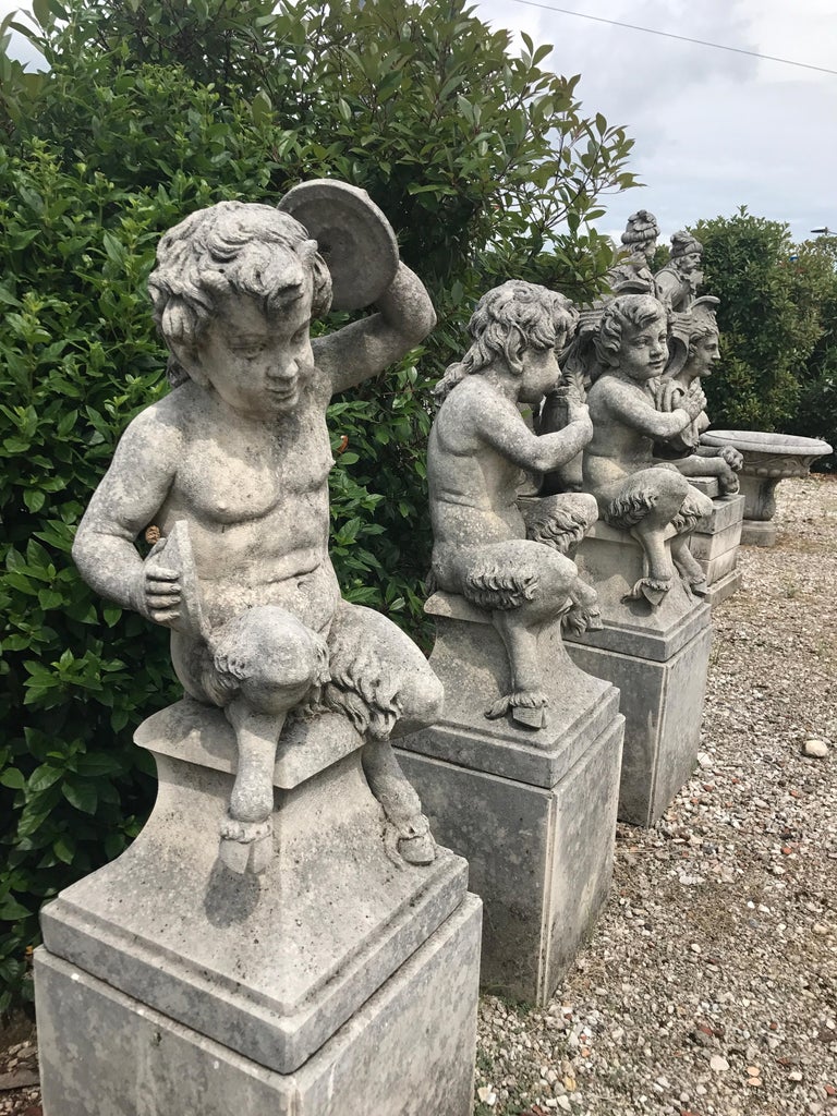 Four Italian Fauns Stone Garden Statues Representing Musicians For Sale