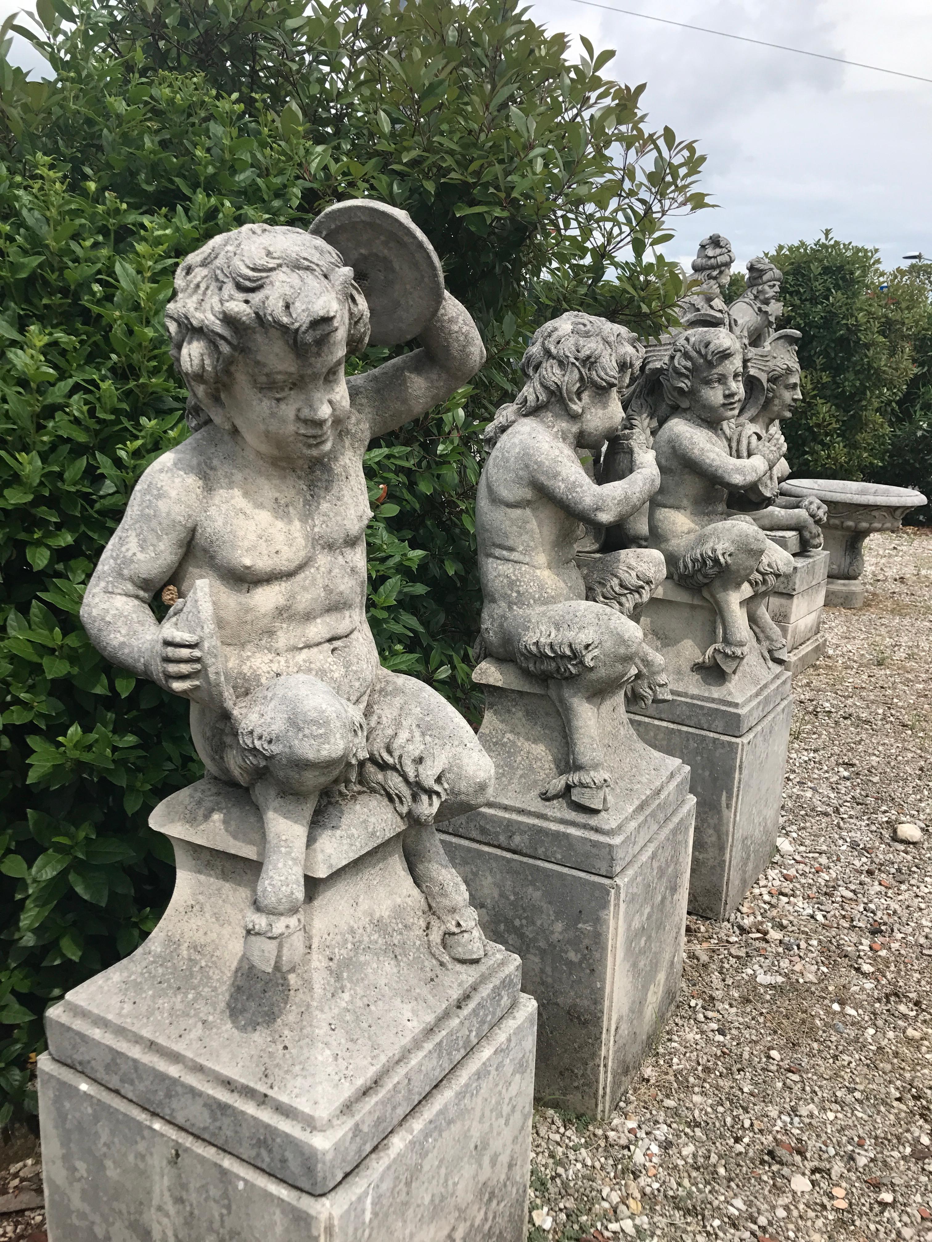 A set of four delicious hand carved limestone fauns figures on shaped pedestals.
Typical example of statues that was inserted in the large parks of the Venetian Villas.