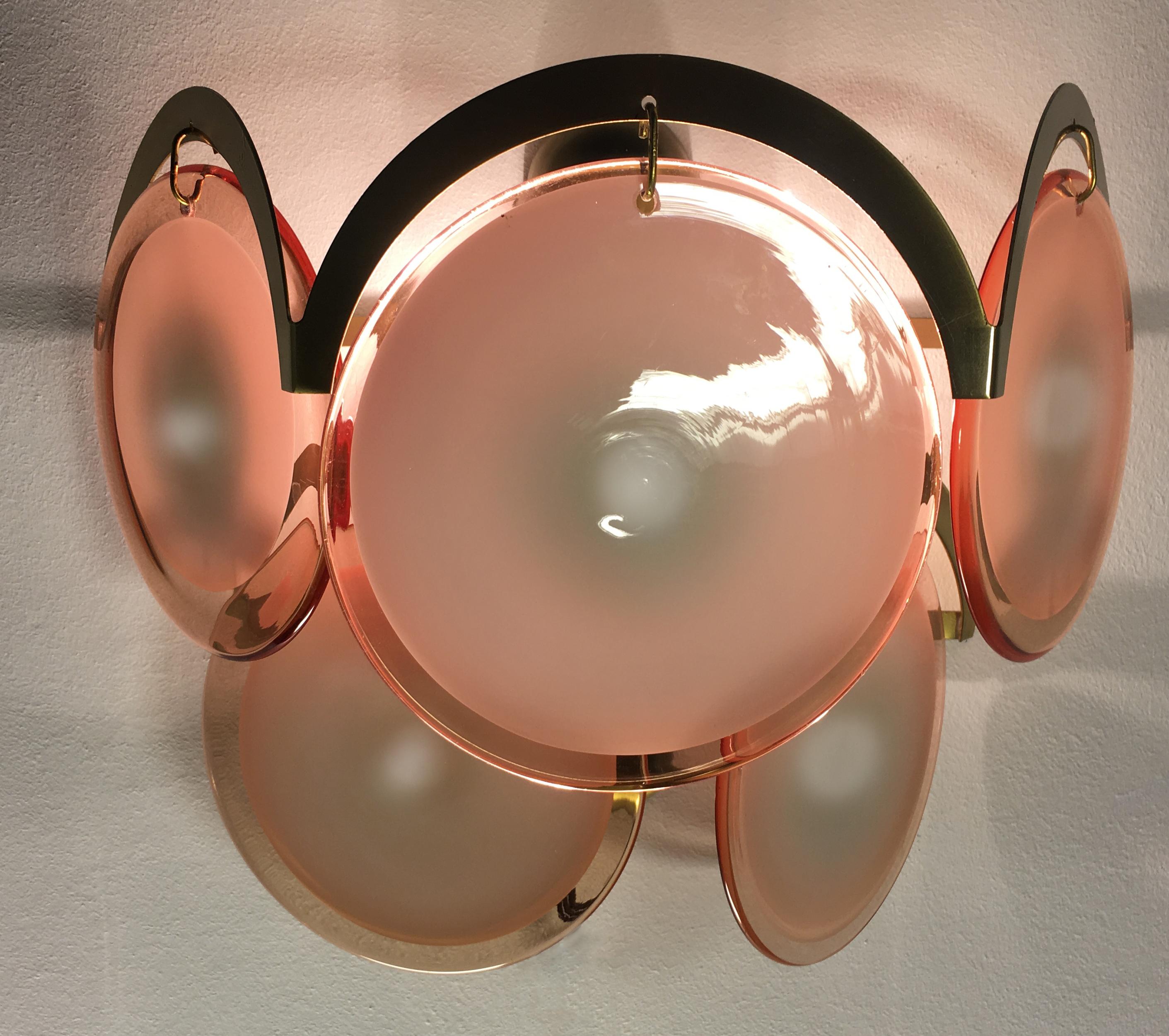 Spectacular four sconces by Vistosi each made of five Murano discs honey color.