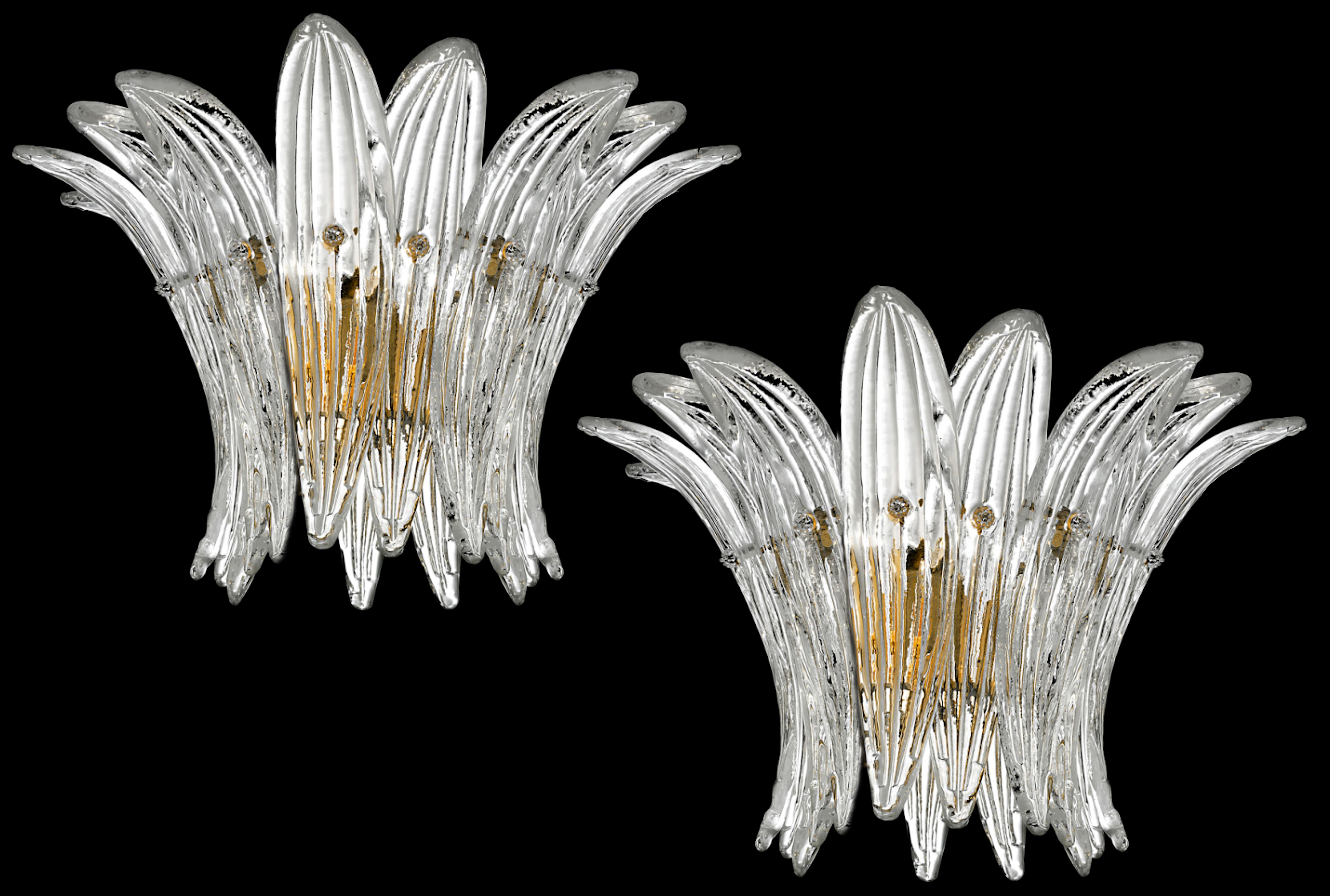 Set of four sconces in the style of Barovier & Toso.
Each sconce is composed of 9 palmettes in pure Murano glass arranged horizontally.