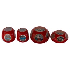 Four Italian Red Millefiori Cased Glass Paperweights