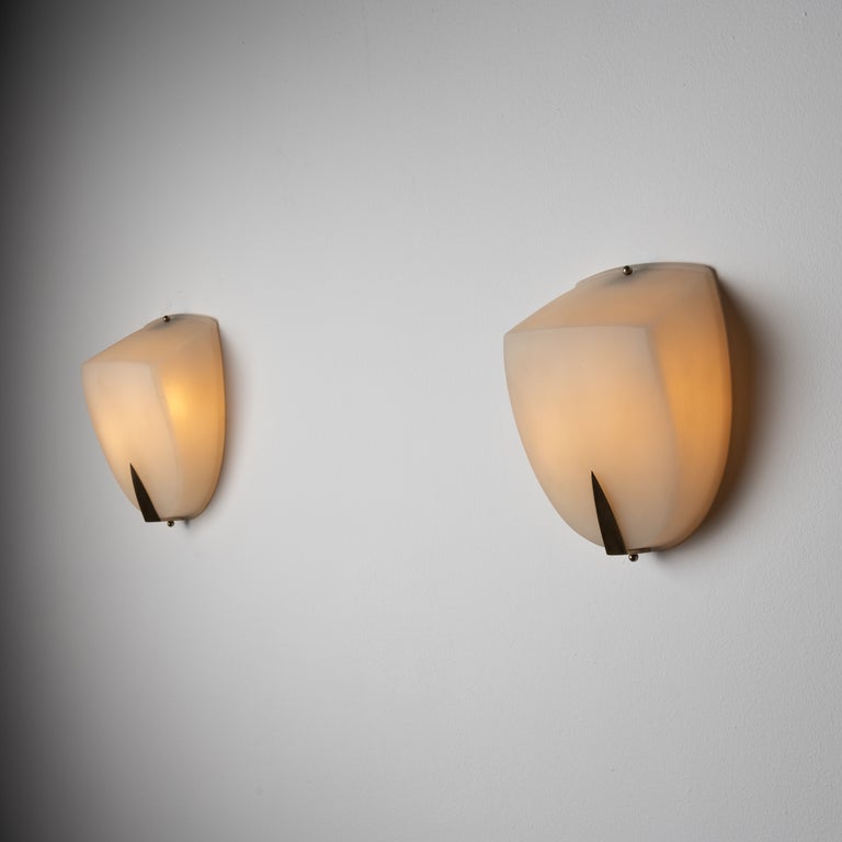 Two pairs of Italian sconces. Designed and manufactured in Italy, circa 1950's. Frosted glass diffusers with brass hardware. Rewired for U.S. standards. We recommend two E12 30w maximum bulb per fixture. Bulbs included as a one time courtesy. Two