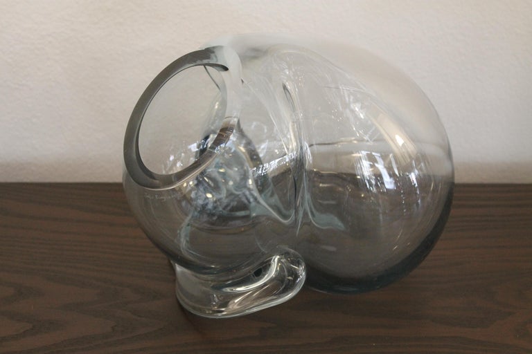 Four large clear art glass orb sculptures by glassblower, artist John Bingham, circa 1980s. These hand blown glass sculptures have a biomorphic free form design. They vary in size up to 14