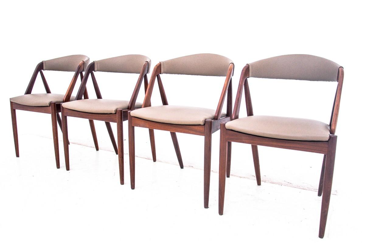 A set of four teak chairs designed by Kai Kristiansen. The classic, iconic model 31. Light, stable and interesting structure. The chairs have undergone restoration of wood. They are upholstered with new cream beige Italian natursal leather.