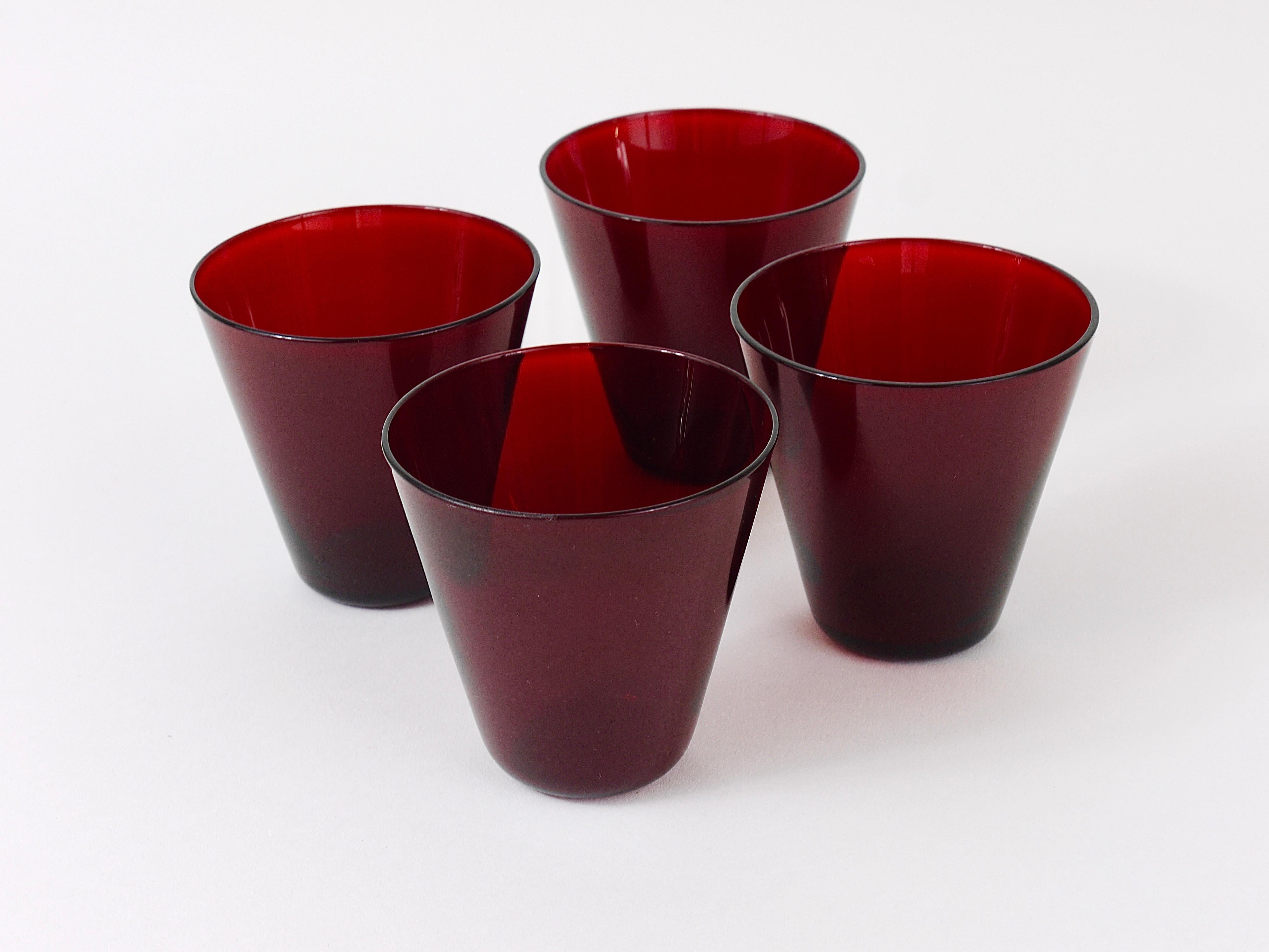 A set of four fine Kartio drinking glasses in rare red glass from the 1950s. Designed by Kaj Franck, executed by Nuutajarvi Nottsjo Finland. In excellent condition.
