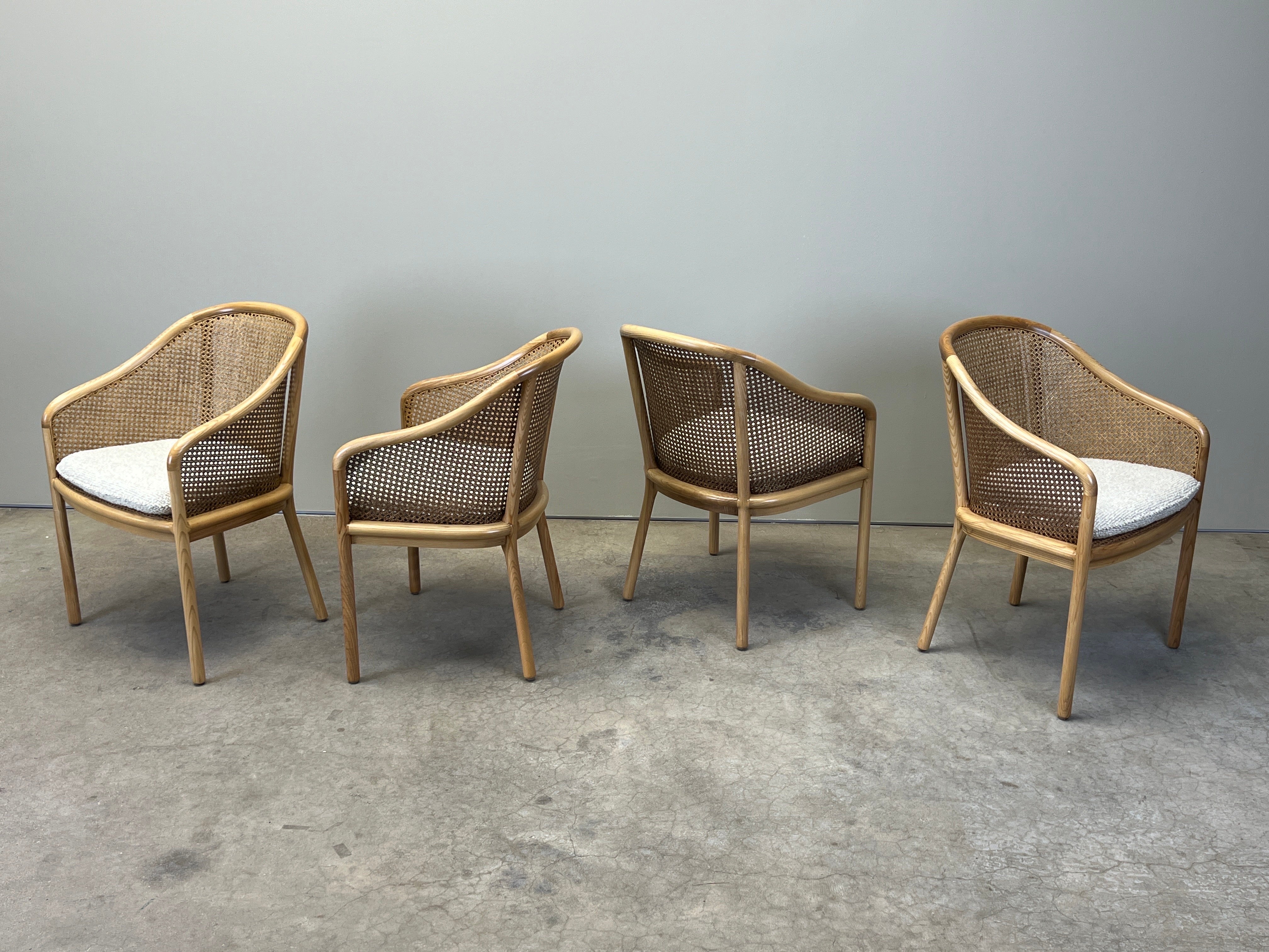 A set of four full cane 'landmark' chairs designed by Ward Bennett for Brickel with loose seat cushions. 