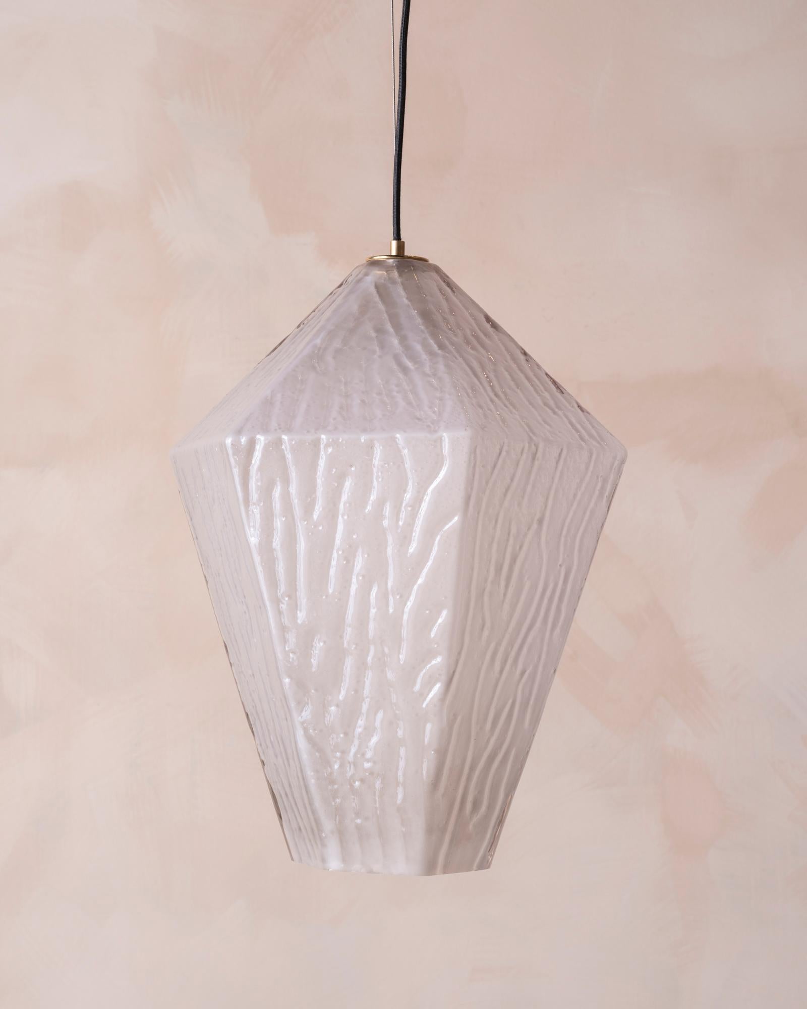 Handblown polyhedral glass, open at the base and with an etched, rivulet texture on the outer wall; suspended from a wire. 

OUR REFERENCE N8482 A-D
