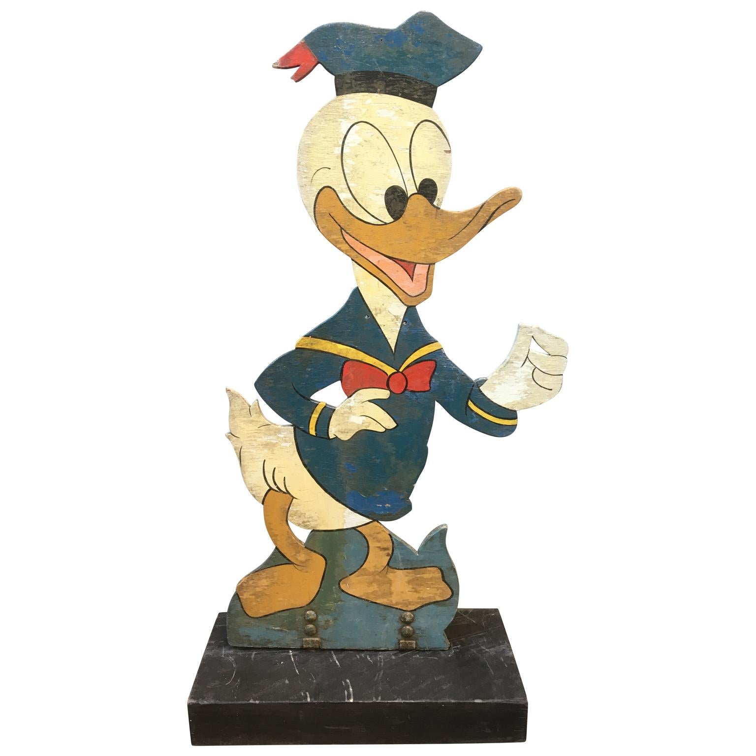 Four large wooden midcentury Disney figures Donald, Daisy, Micky Mouse And Pinocchio

Set of four amazing kids-size vintage wooden Disney figures of Donald and Daisy Duck, Micky Mouse and Pinocchio. Each figure is on black painted wooden base (50 cm