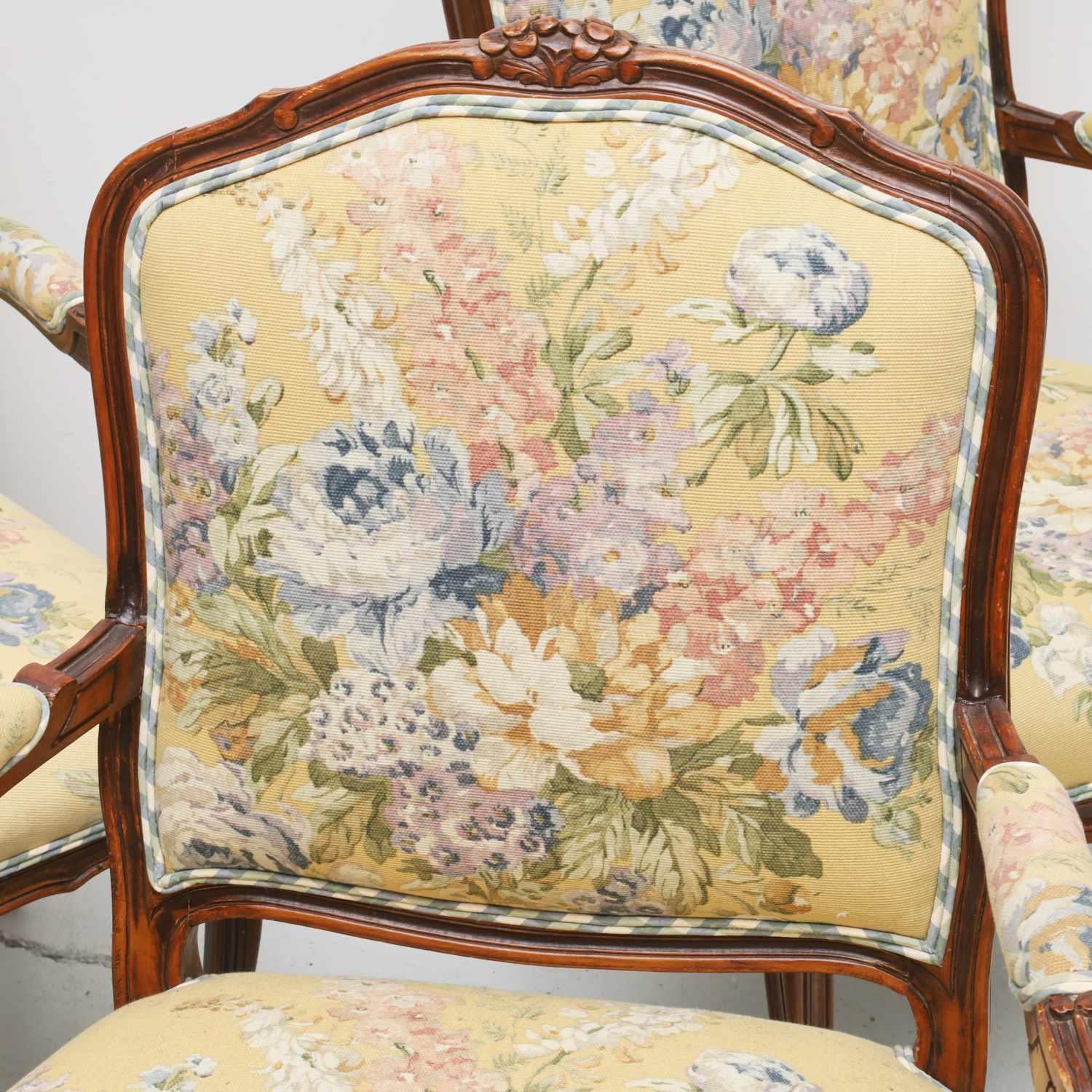 Late 20th c., a set of four Louis XV style armchairs in custom floral tapestry style upholstery with blue, pale green and white gingham seat backs and welting, unmarked.

Dimensions:
40