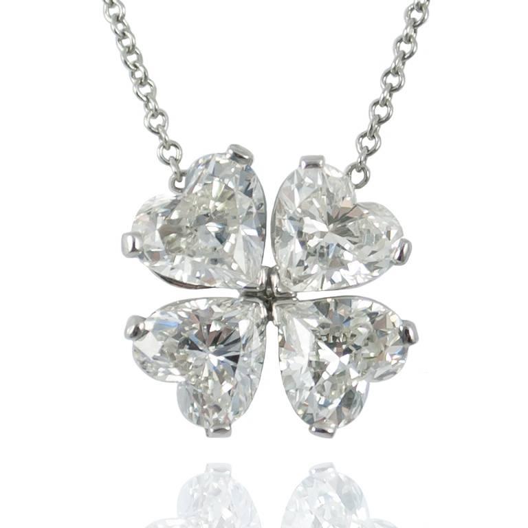 This whimsical piece of fine jewelry features a four leaf clover, comprised of four individual heart-shaped diamonds totaling 3.01 carats in weight and graded as F VS.  It is set in platinum and the chain can be adjusted to two different lengths.